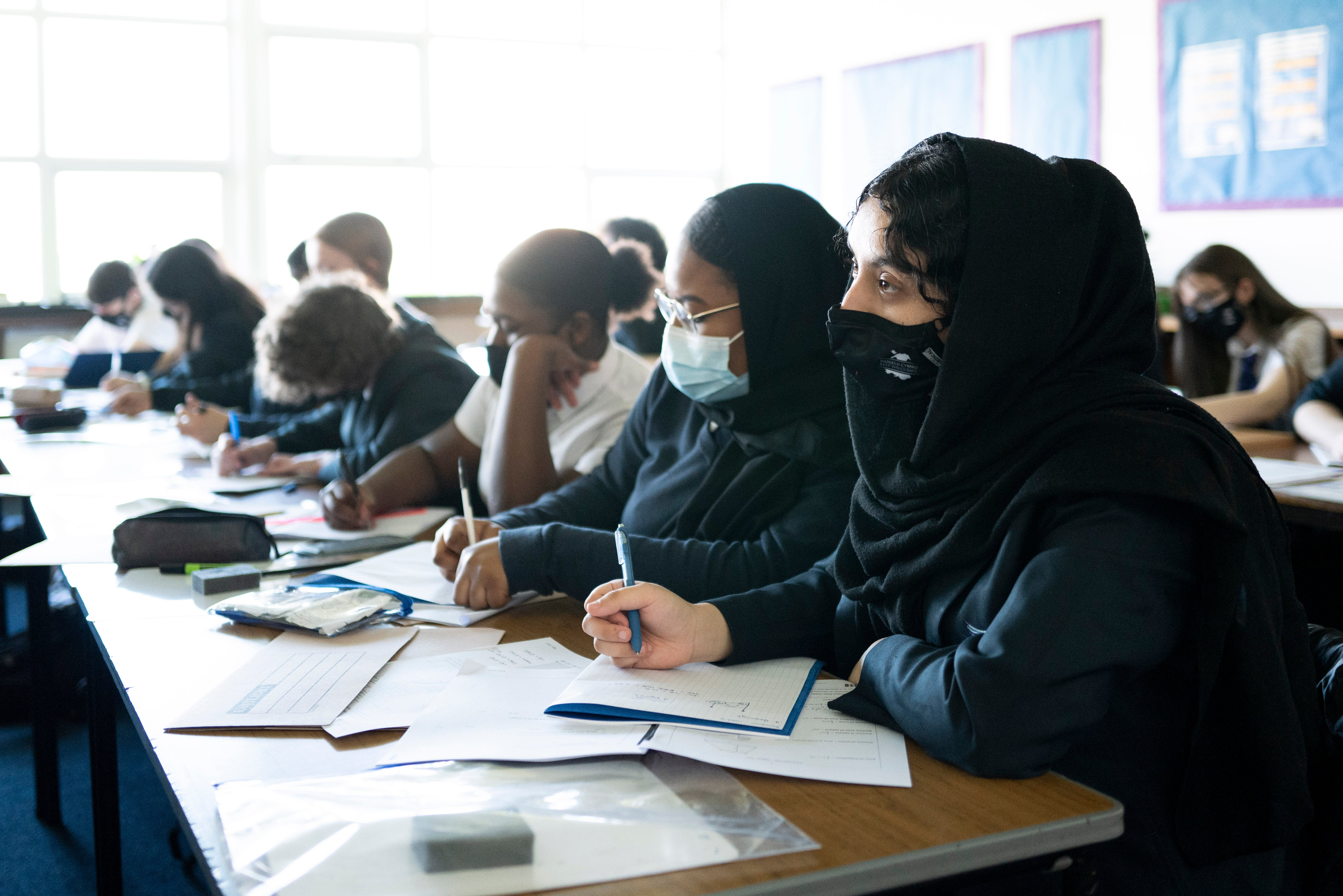 Masks and social distancing are likely to be ditched by many schools when pupils return this week