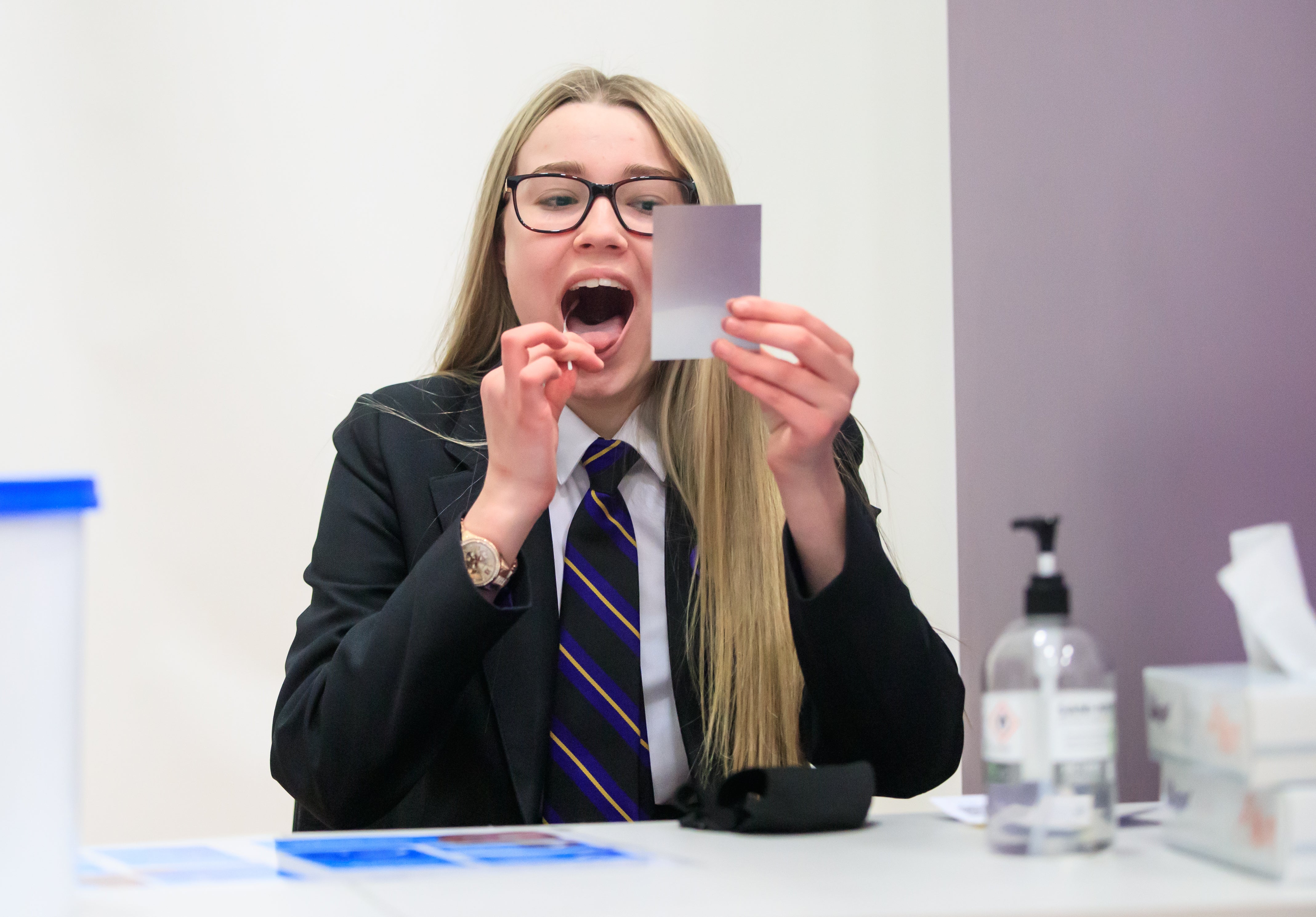 A student takes a lateral flow test at a school in Doncaster, Yorkshire, in March 2021.