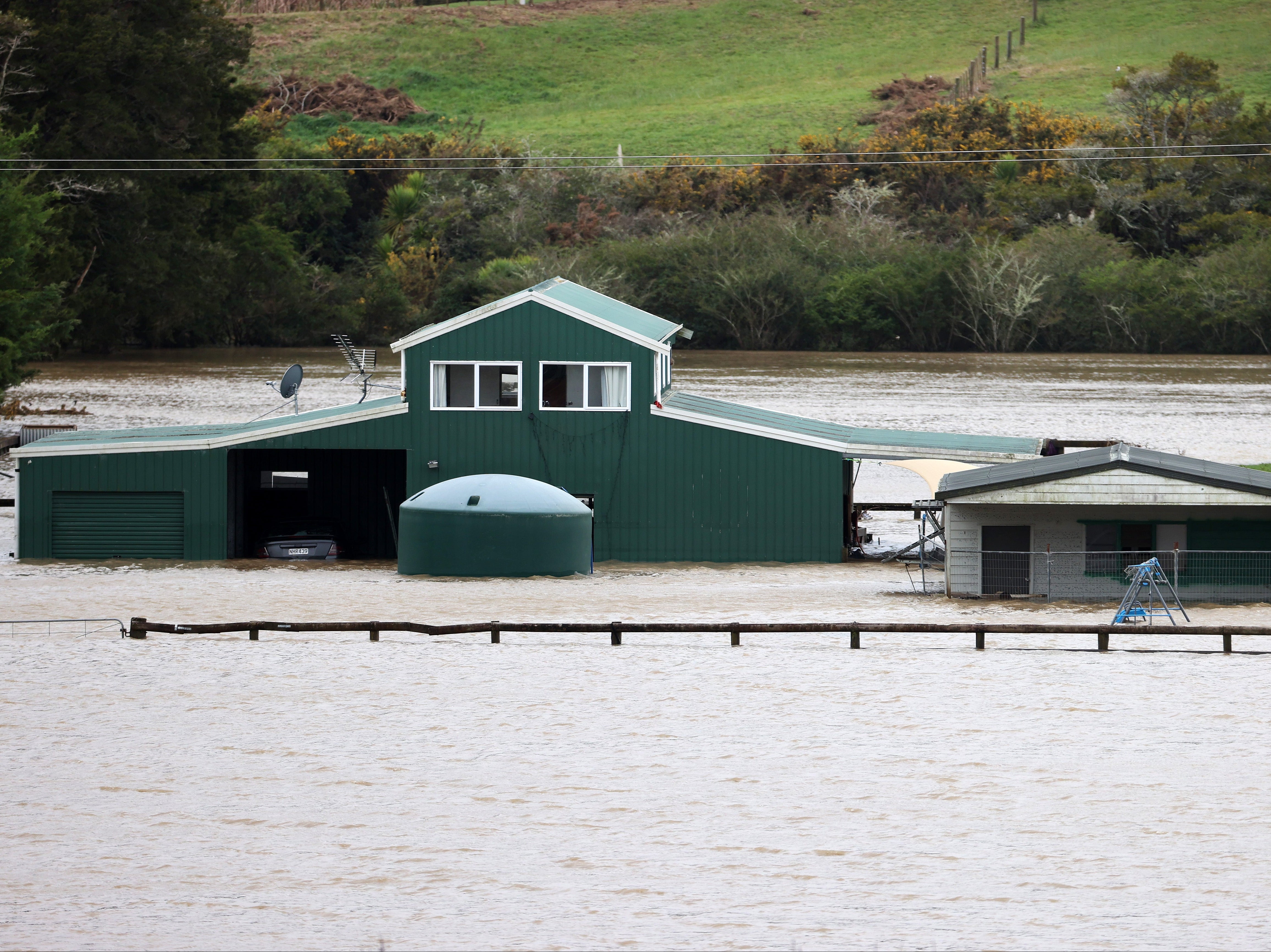 Homes were evacuated in parts of Auckland after heavy rain caused flash flooding