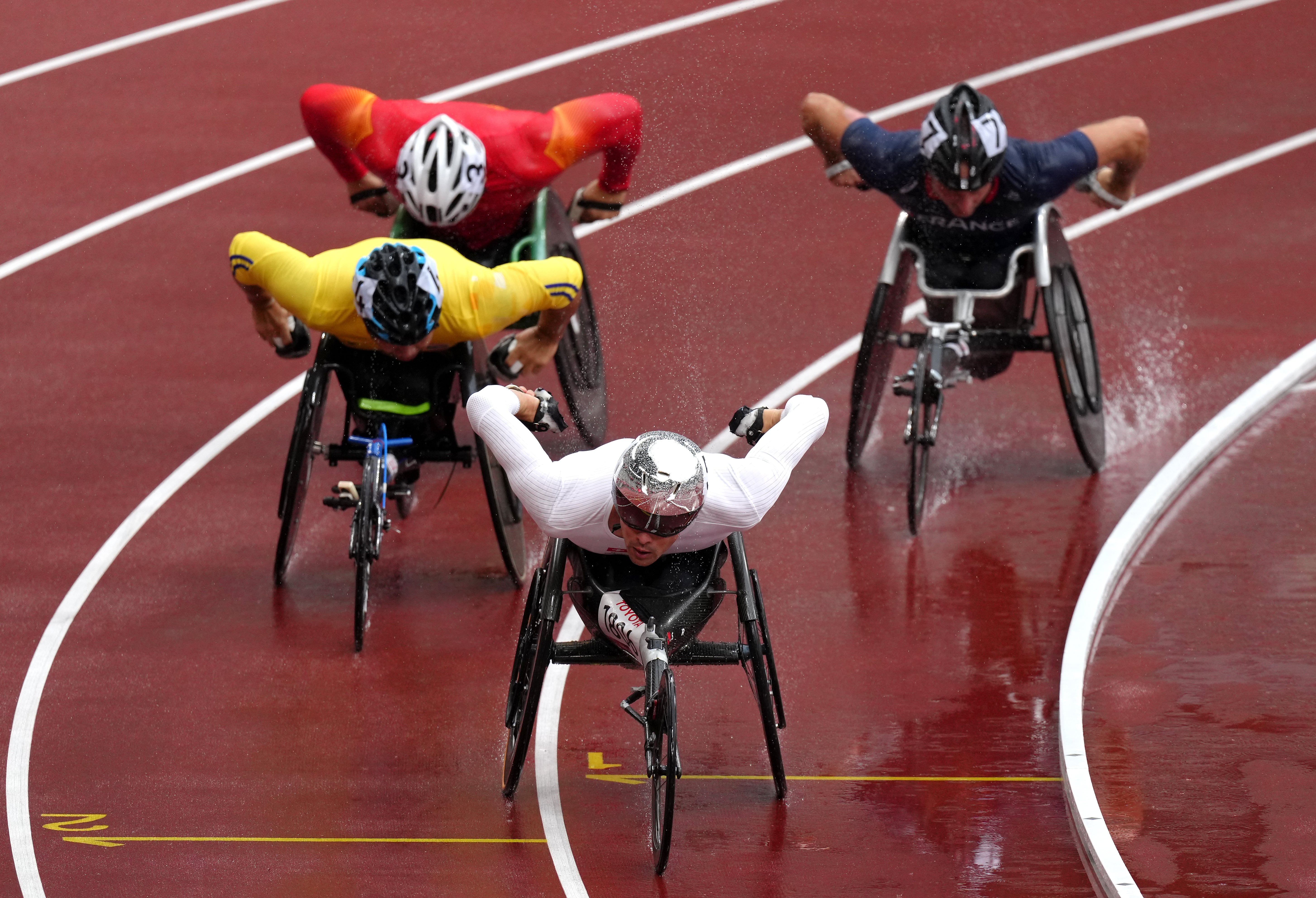 Switzerland’s Marcel Hug on his way to winning the Men’s T54 Round 1 – Heat 2 in the wet at the Olympic Stadium (John Walton/PA)