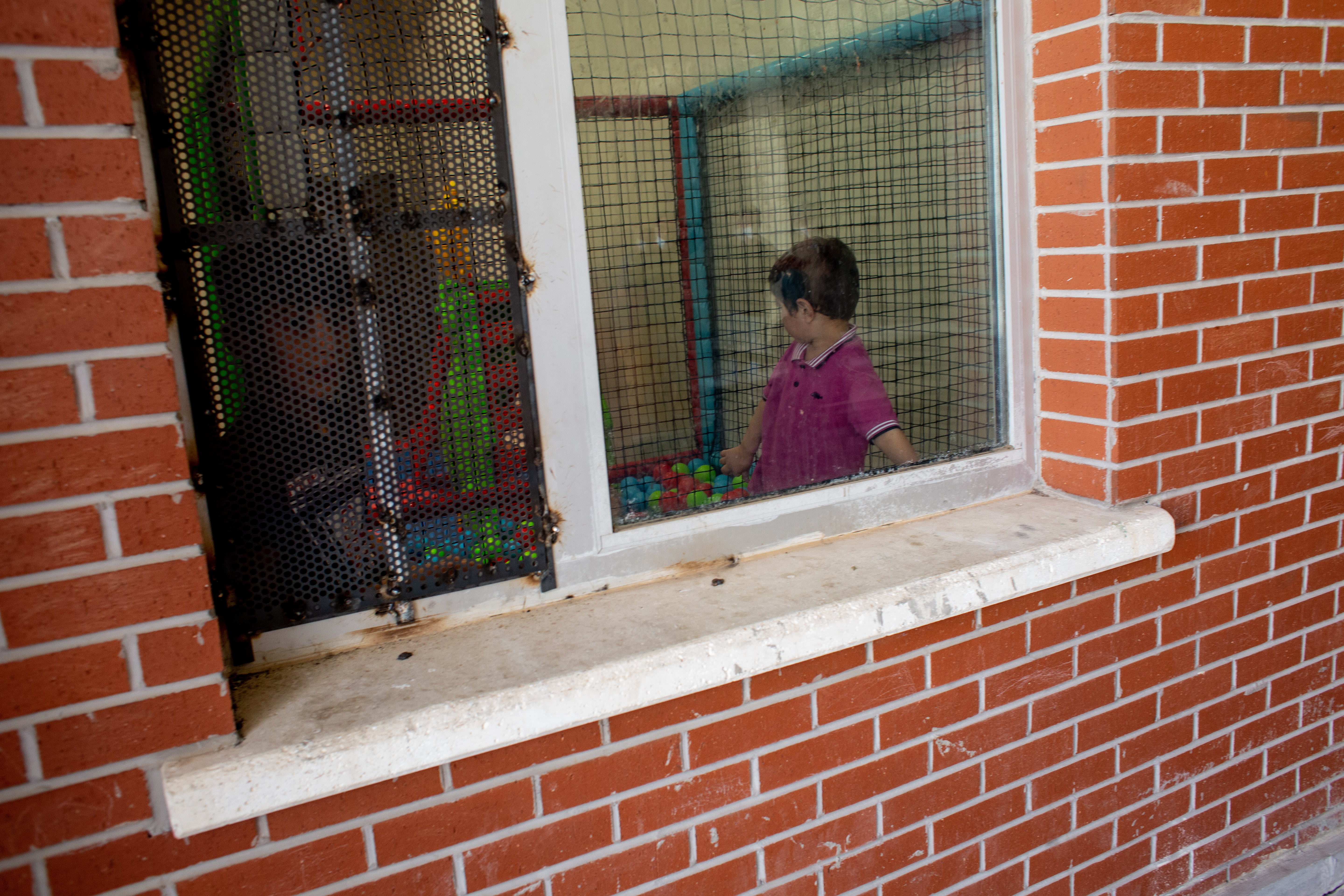 Children are seen playing in the women and families section of Van Deportation Centre, run by the Directorate General of Migration Management