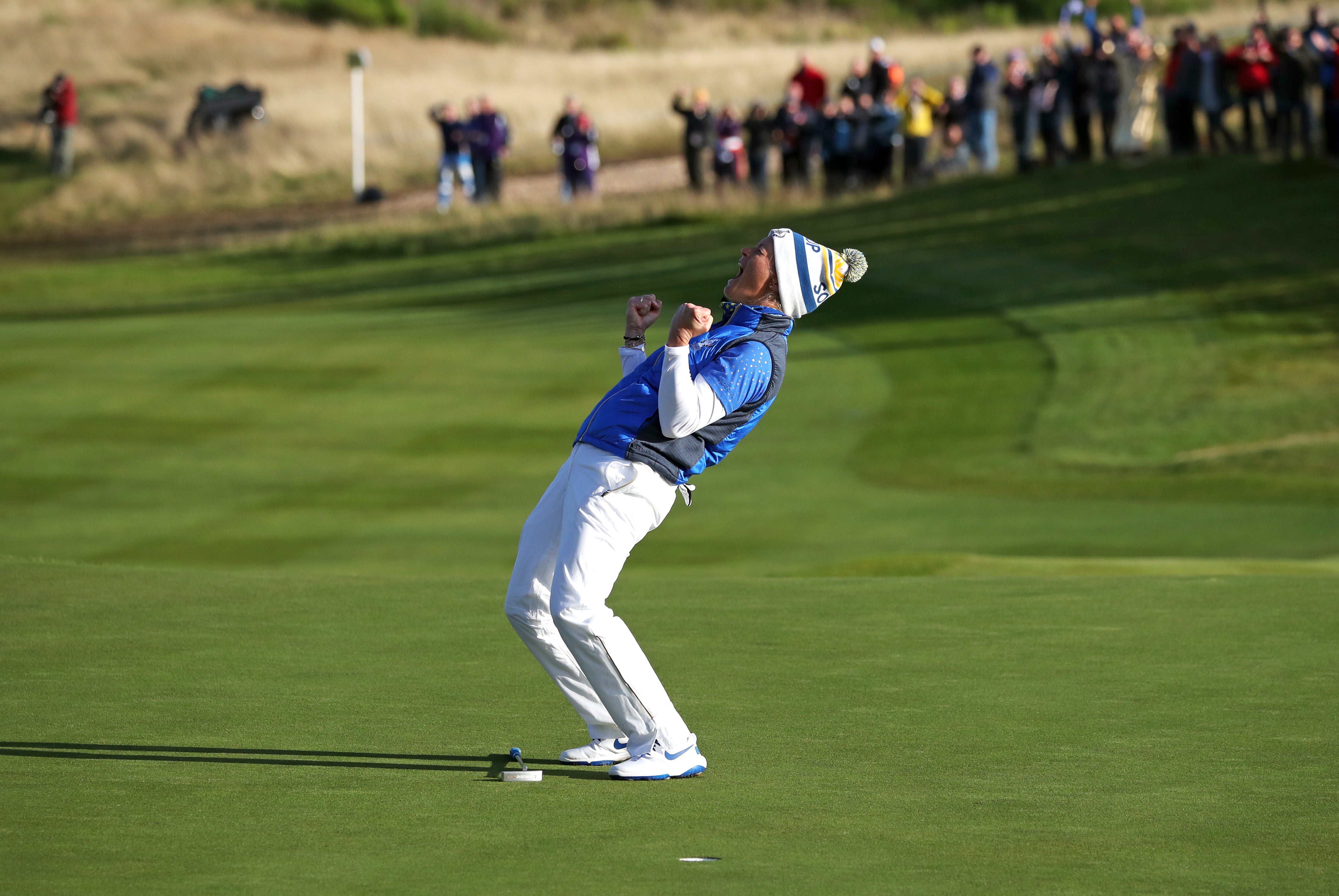 Team Europe’s Suzann Pettersen celebrates her putt on the 18th to win the Solheim Cup (Jane Barlow/PA)