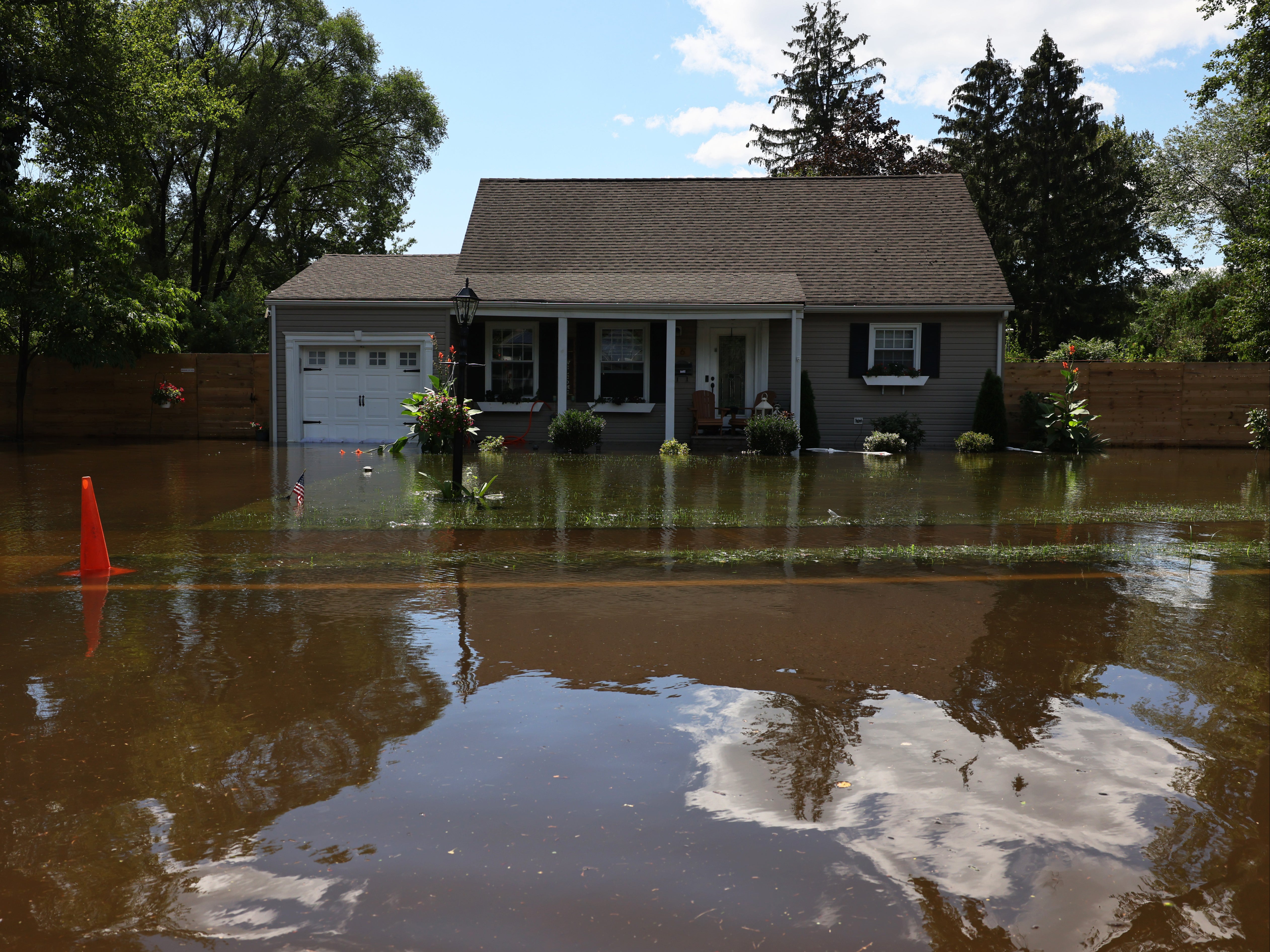 River water floods the front of a home on West Williams Street Road on September 02, 2021 in Lincoln Park, New Jersey