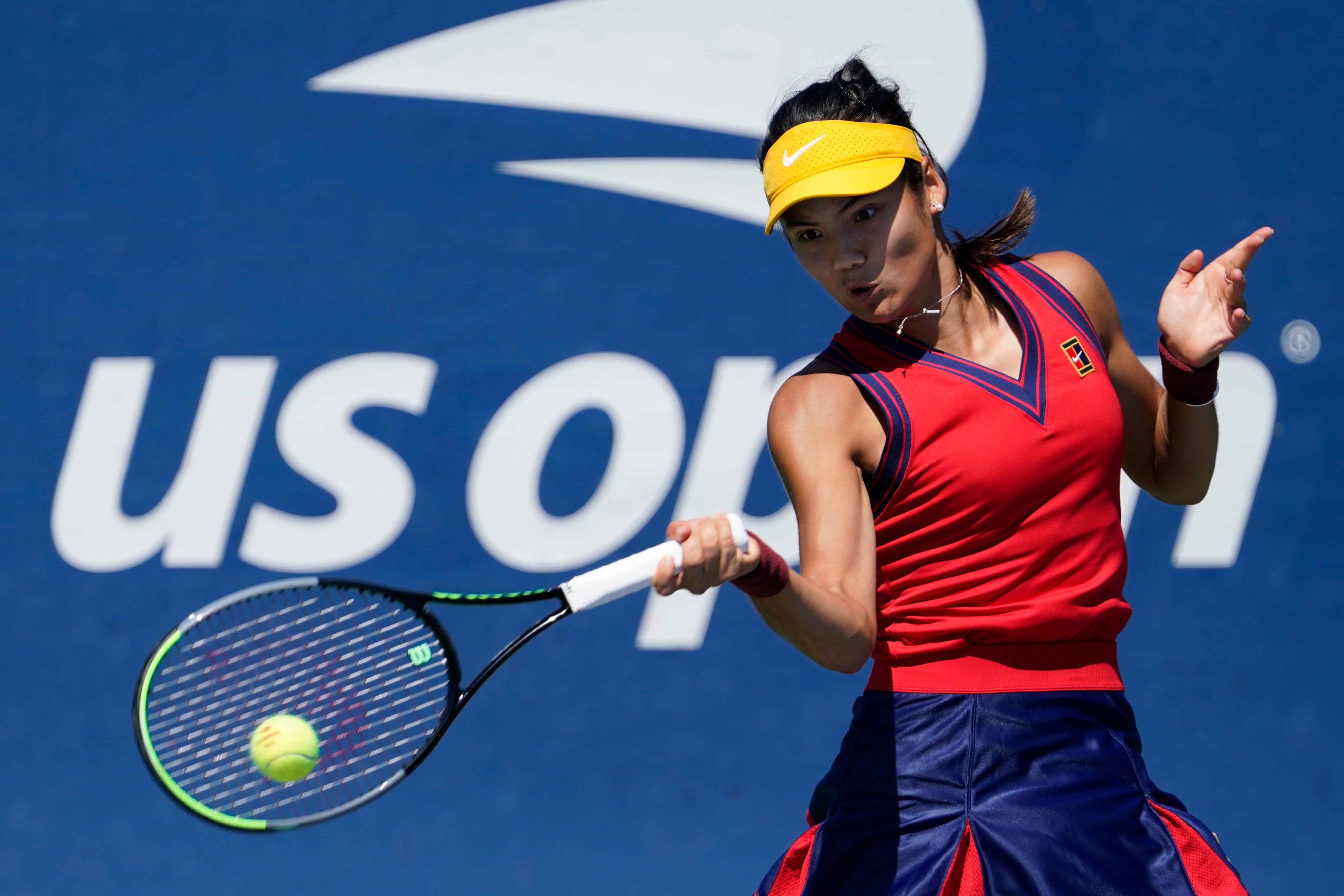 Emma Raducanu hits a forehand during her victory over Zhang Shuai (Seth Wenig/AP)