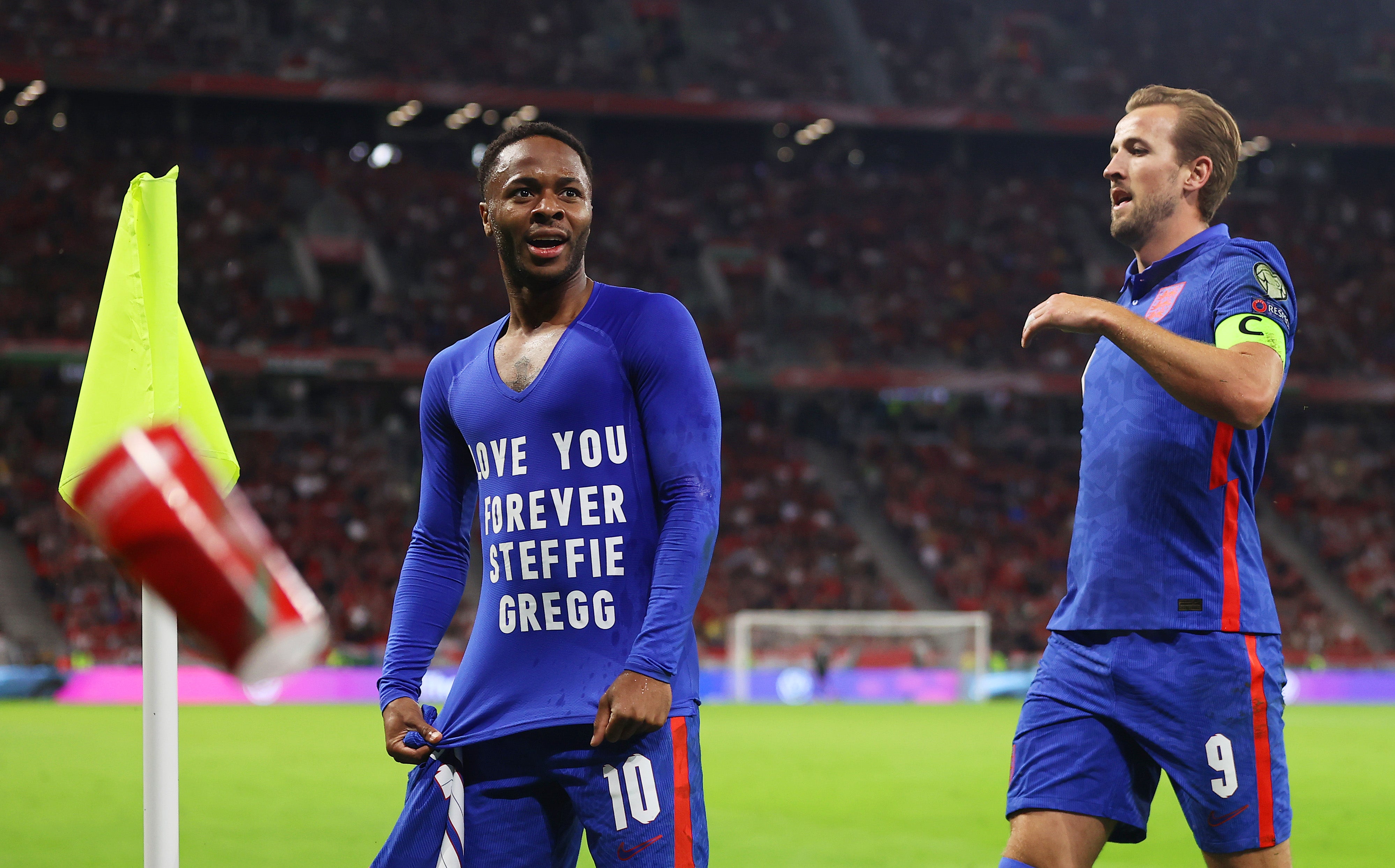 Raheem Sterling celebrates scoring England’s opening goal