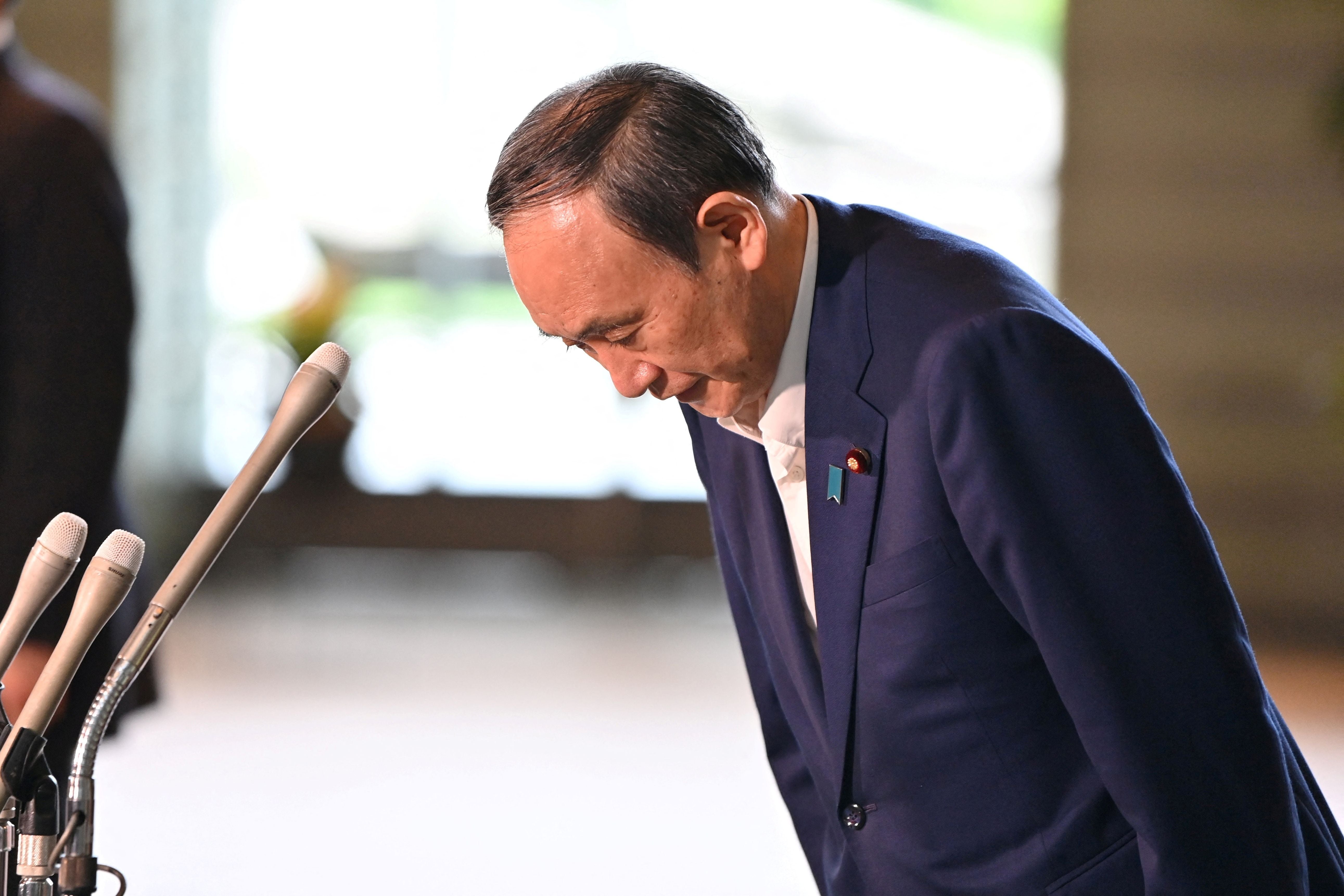 Japan’s prime minister, Yoshihide Suga, bows following his announcement that he will not seek re-election for the Liberal Democratic Party (LDP) leadership this month