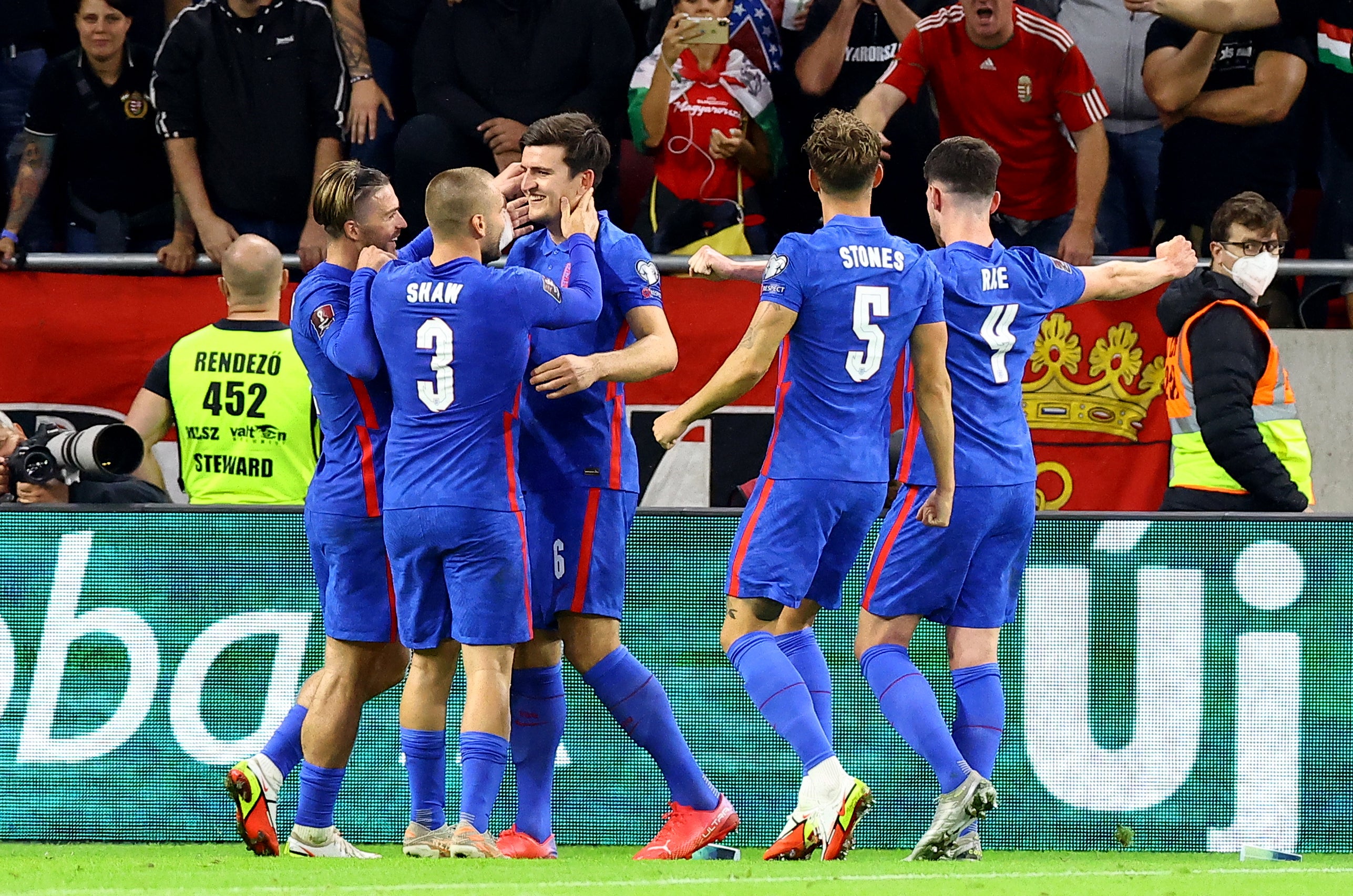 Harry Maguire celebrates scoring England’s third goal against Hungary (Attila Trenka/PA)