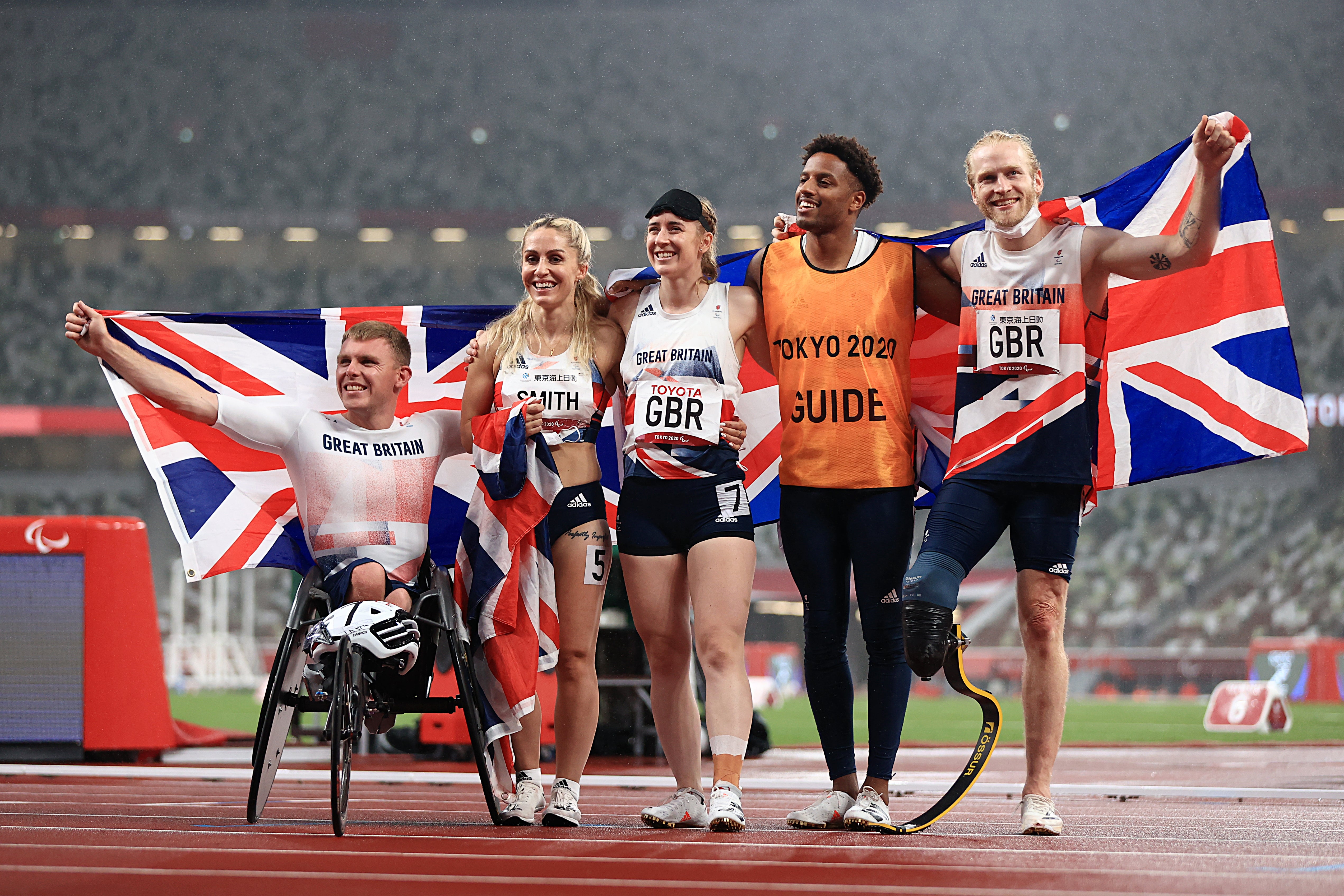 Nathan McGuire, Ali Smith, Libby Clegg, guide Chris Clarke and Jonnie Peacock celebrate