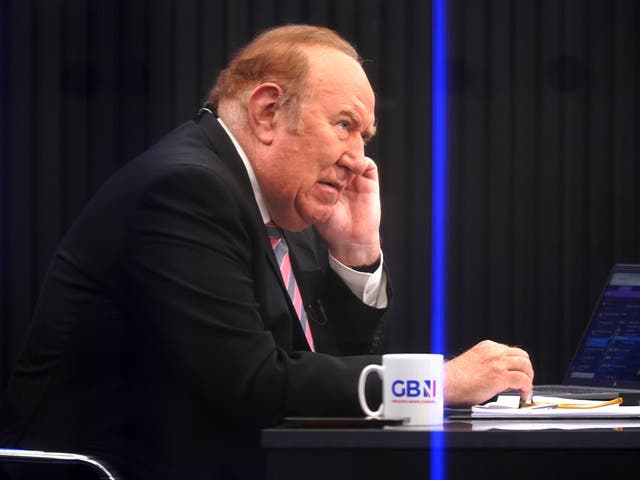 <p>Andrew Neil prepares to broadcast from a studio during the launch event for GB News</p>