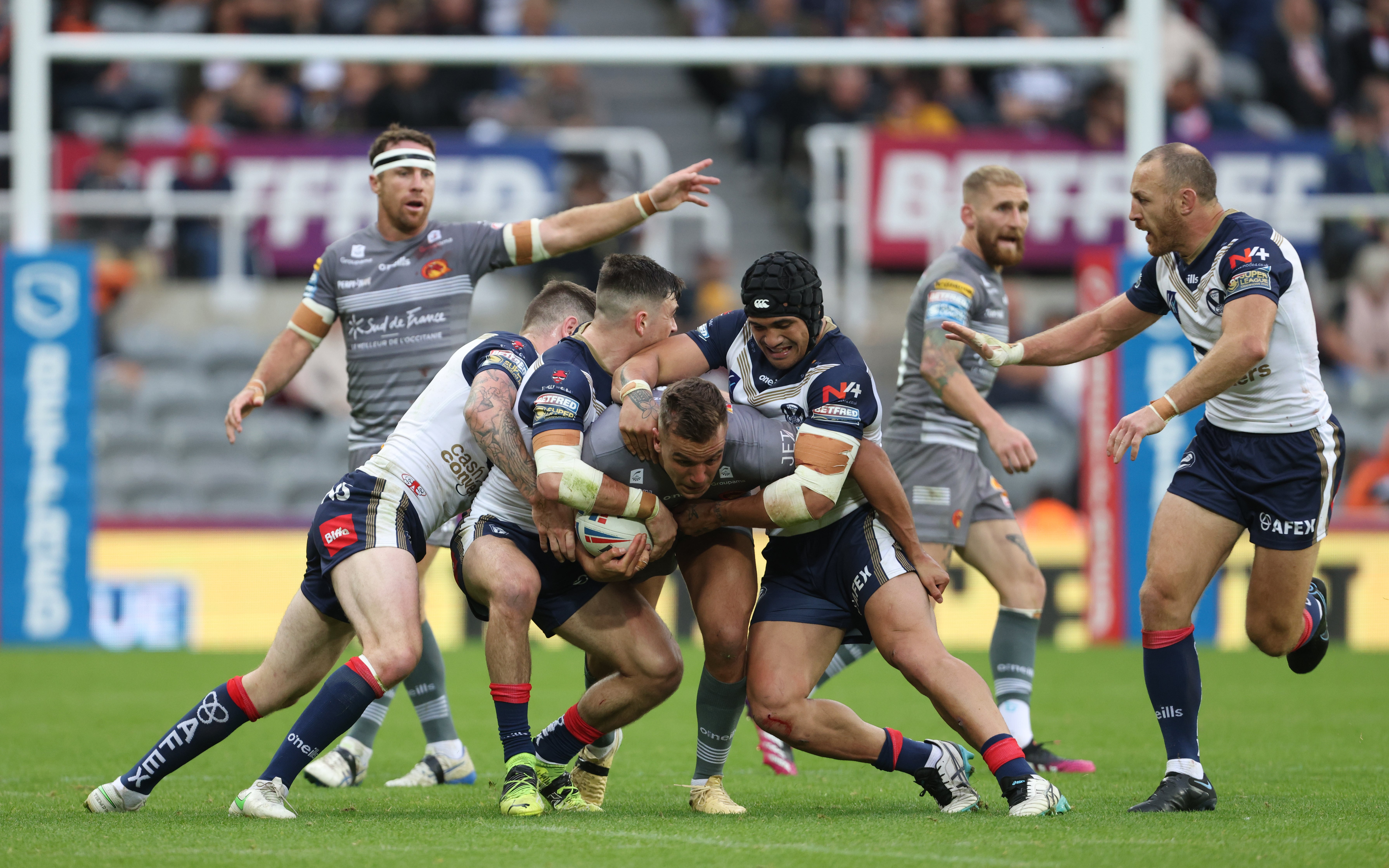 Catalans Dragons’ Josh Drinkwater is tackled during the Magic Weekend game with St Helens (Richard Sellers/PA)