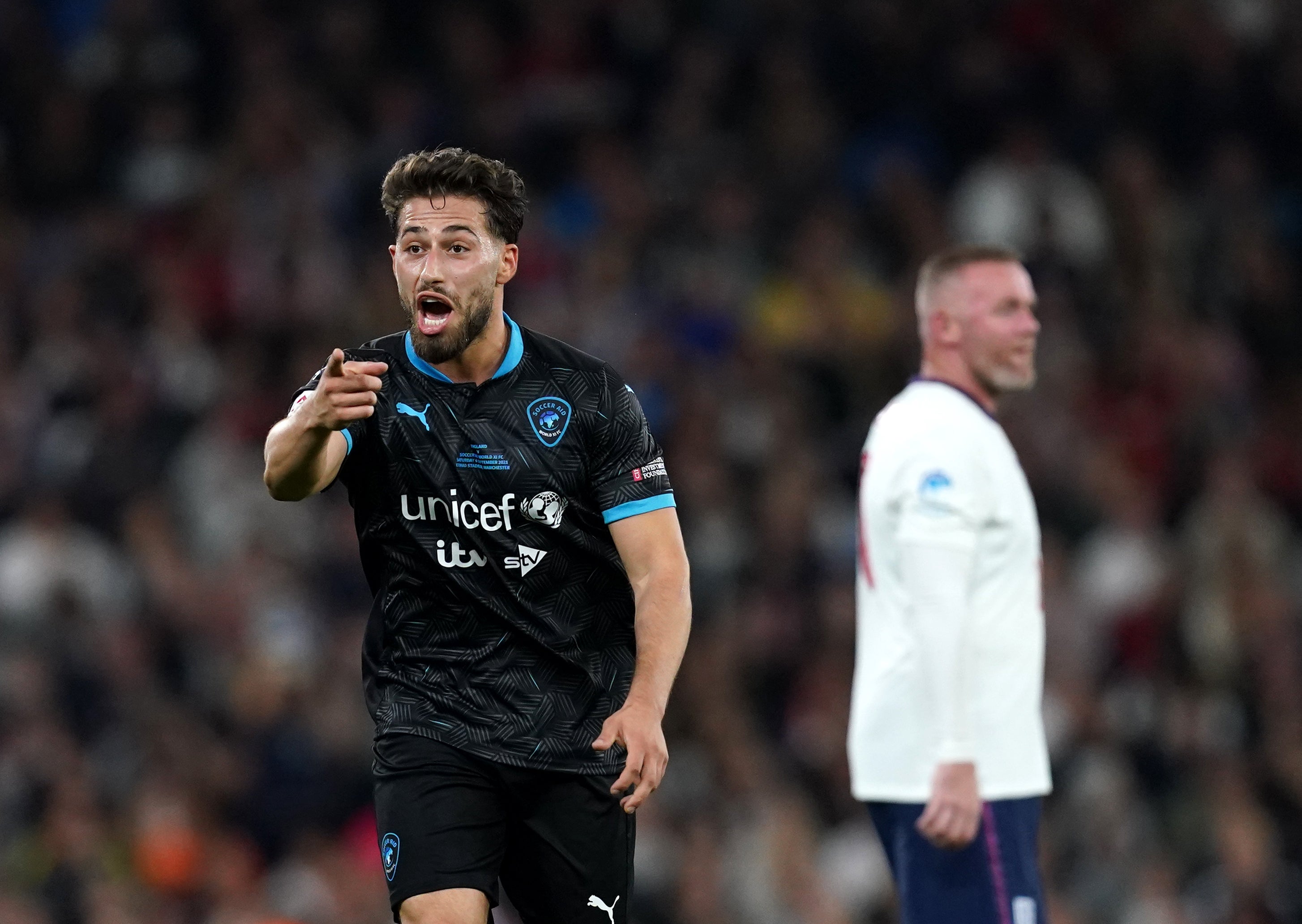 World XI’s Kem Cetinay (left) was on target against England at the Etihad Stadium (Martin Rickett/PA)