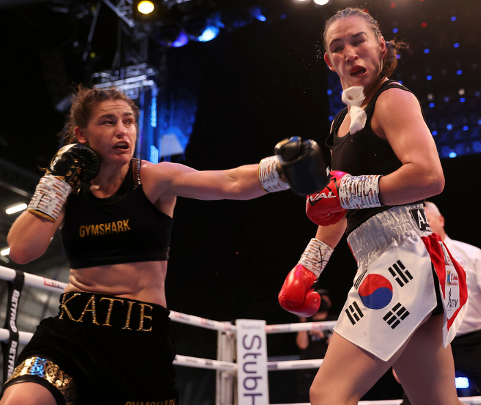 Katie Taylor lands a heavy shot on Jennifer Han