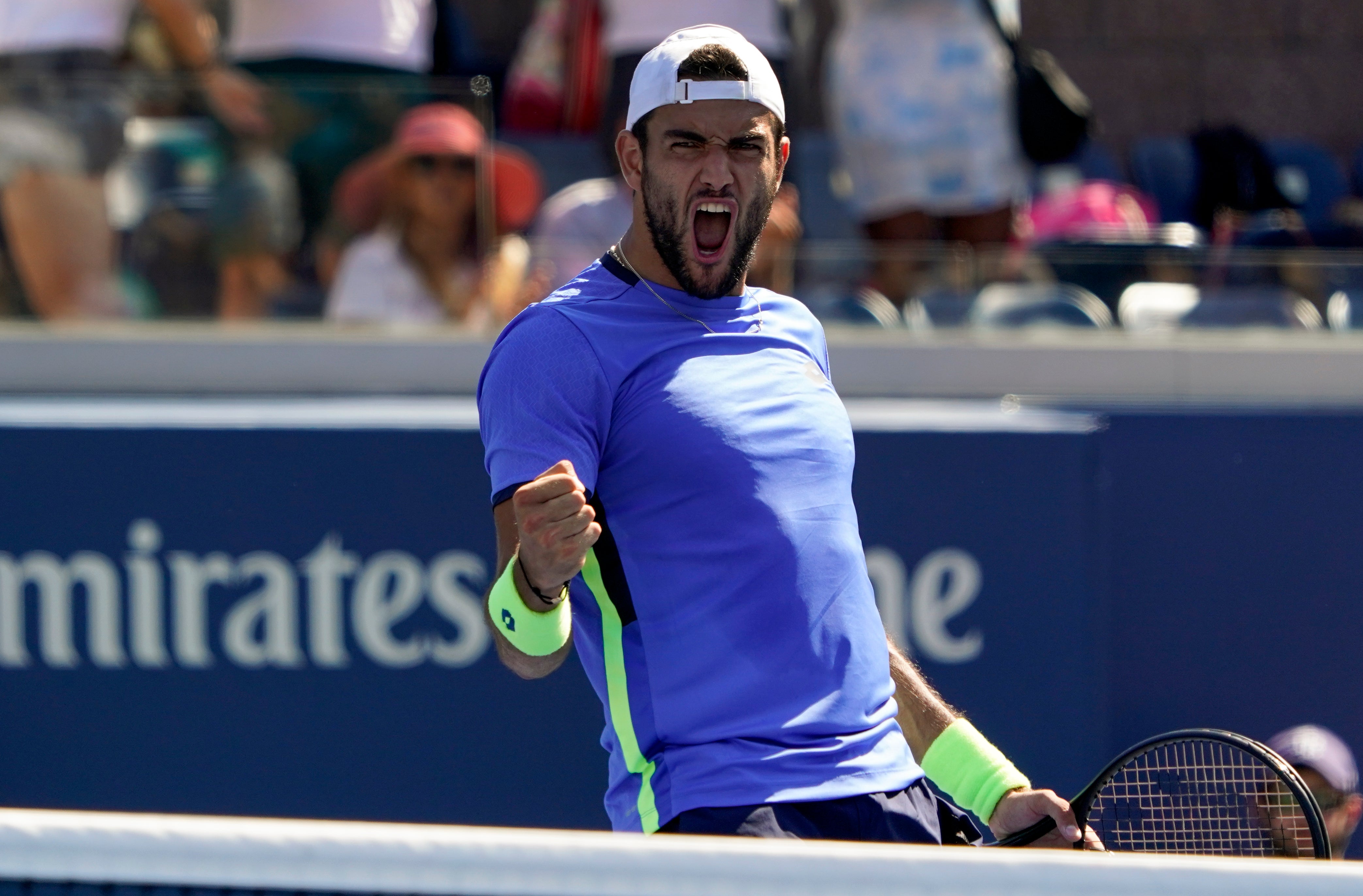 Matteo Berrettini celebrates his five-set win (Elise Amendola/AP)