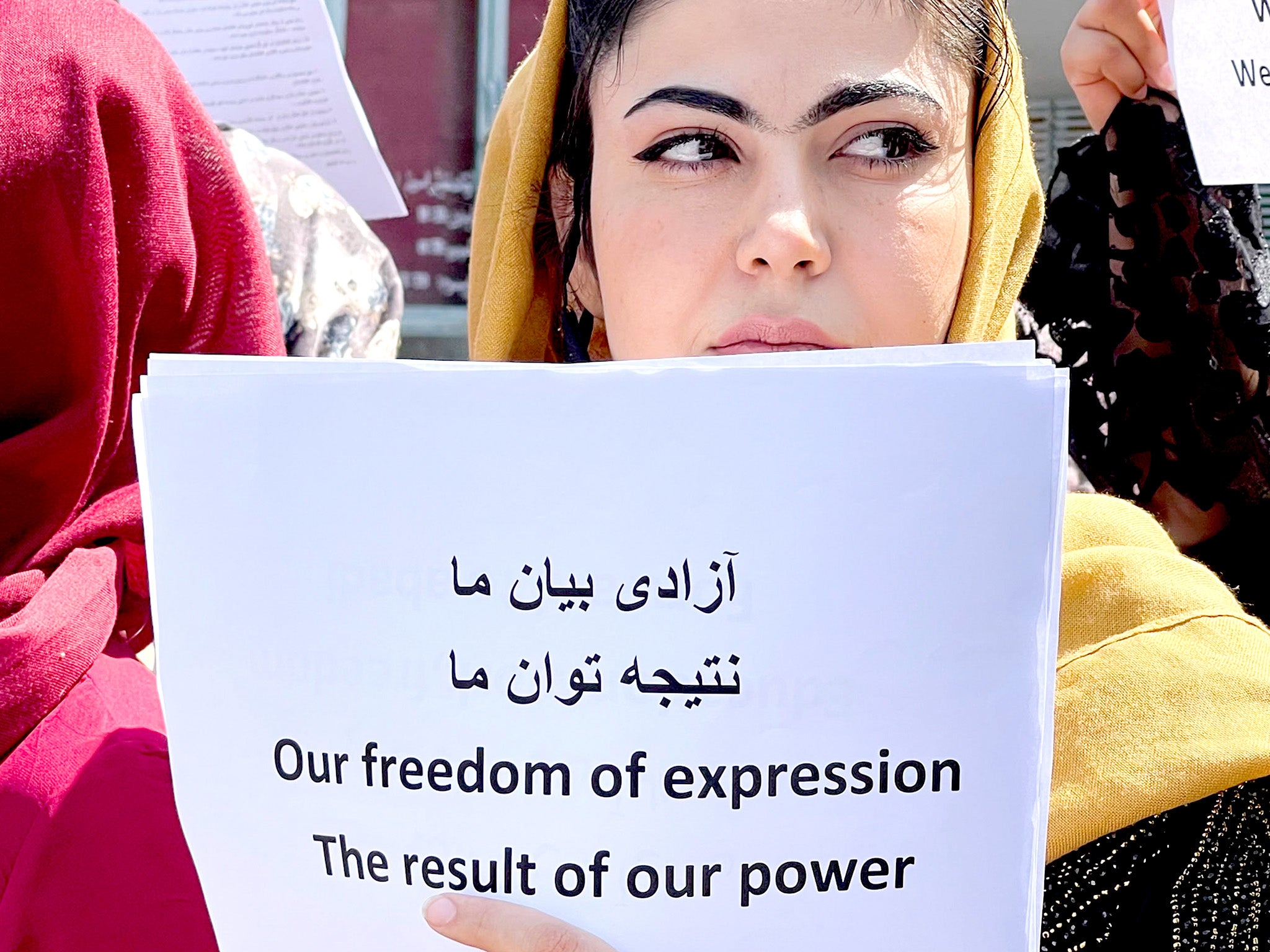 Women gather to demand their rights under the Taliban rule during a protest in Kabul