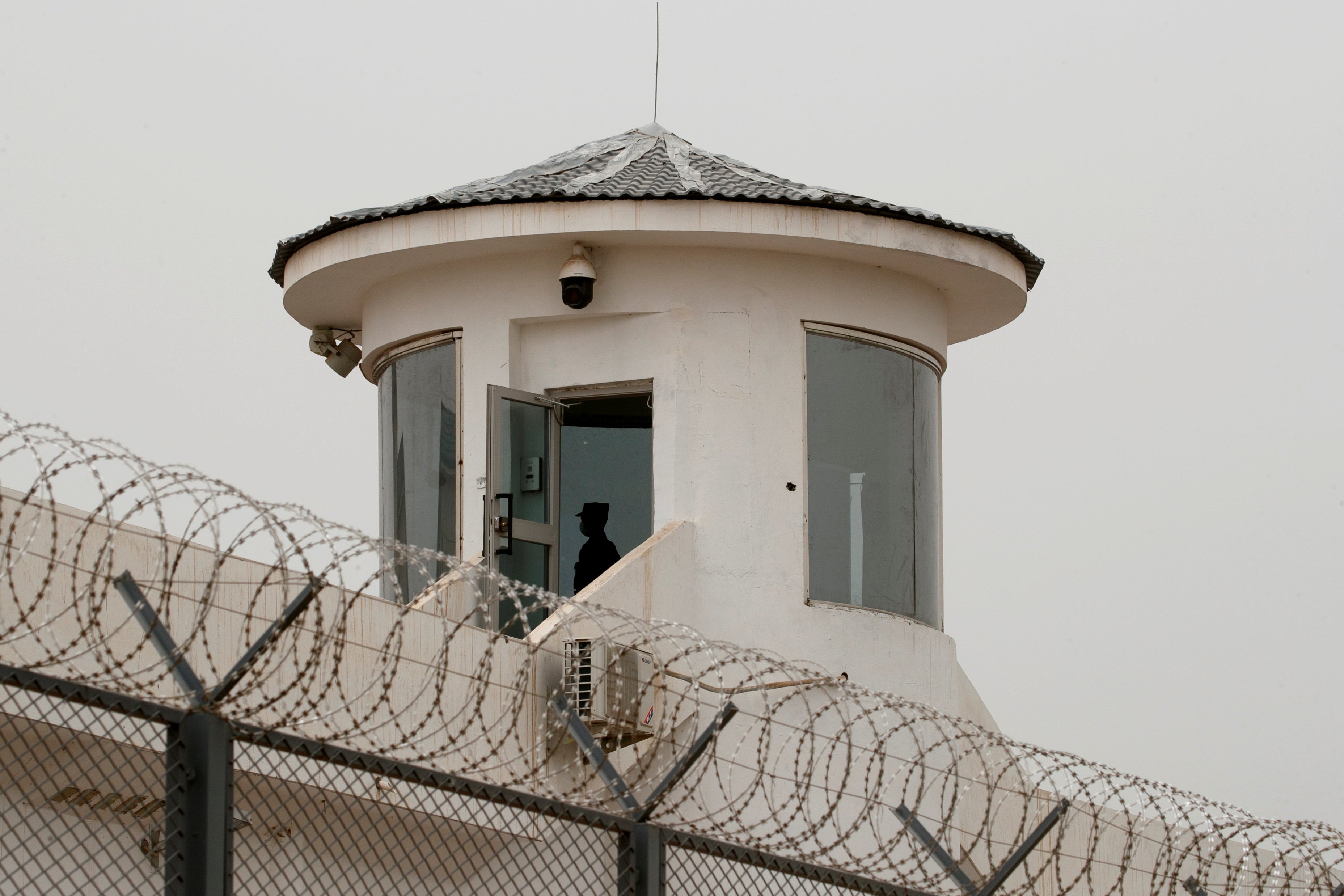 A guard stands in a watchtower of Kashgar prison in Xinjiang, in 2021