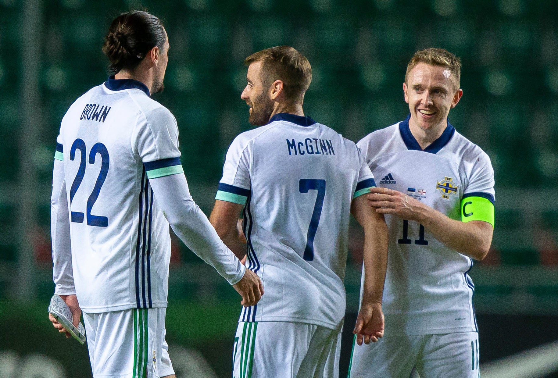 Shane Ferguson, right, struck the winner in Northern Ireland’s victory over Estonia (Raul Mee/AP)