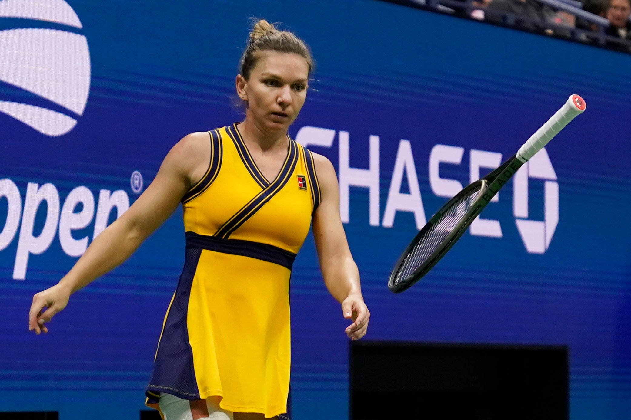 Simona Halep tosses her racket in her defeat to Elina Svitolina (Seth Wenig/AP).