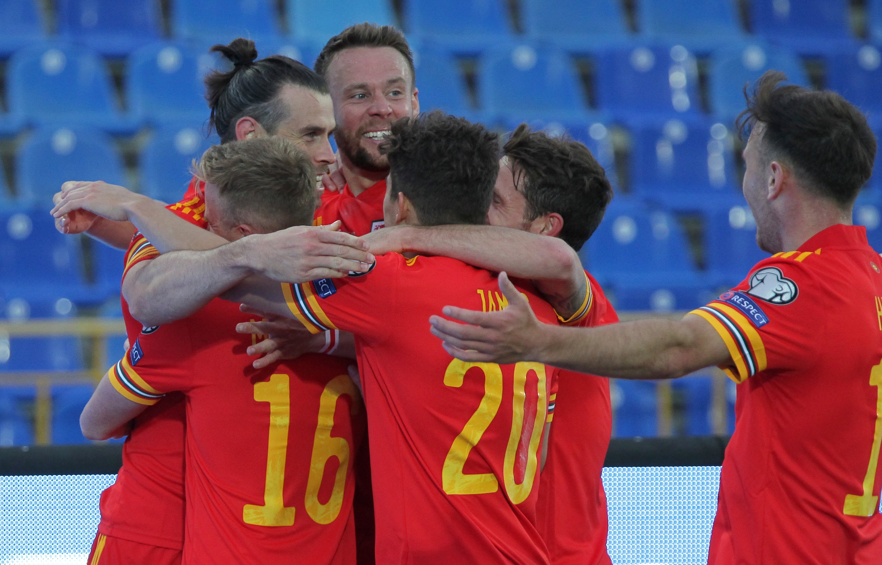 Wales captain Gareth Bale (second left) celebrates with team-mates after scoring in the 3-2 World Cup qualifying victory over Belarus on Sunday (Alexey Nasyrov/AP)