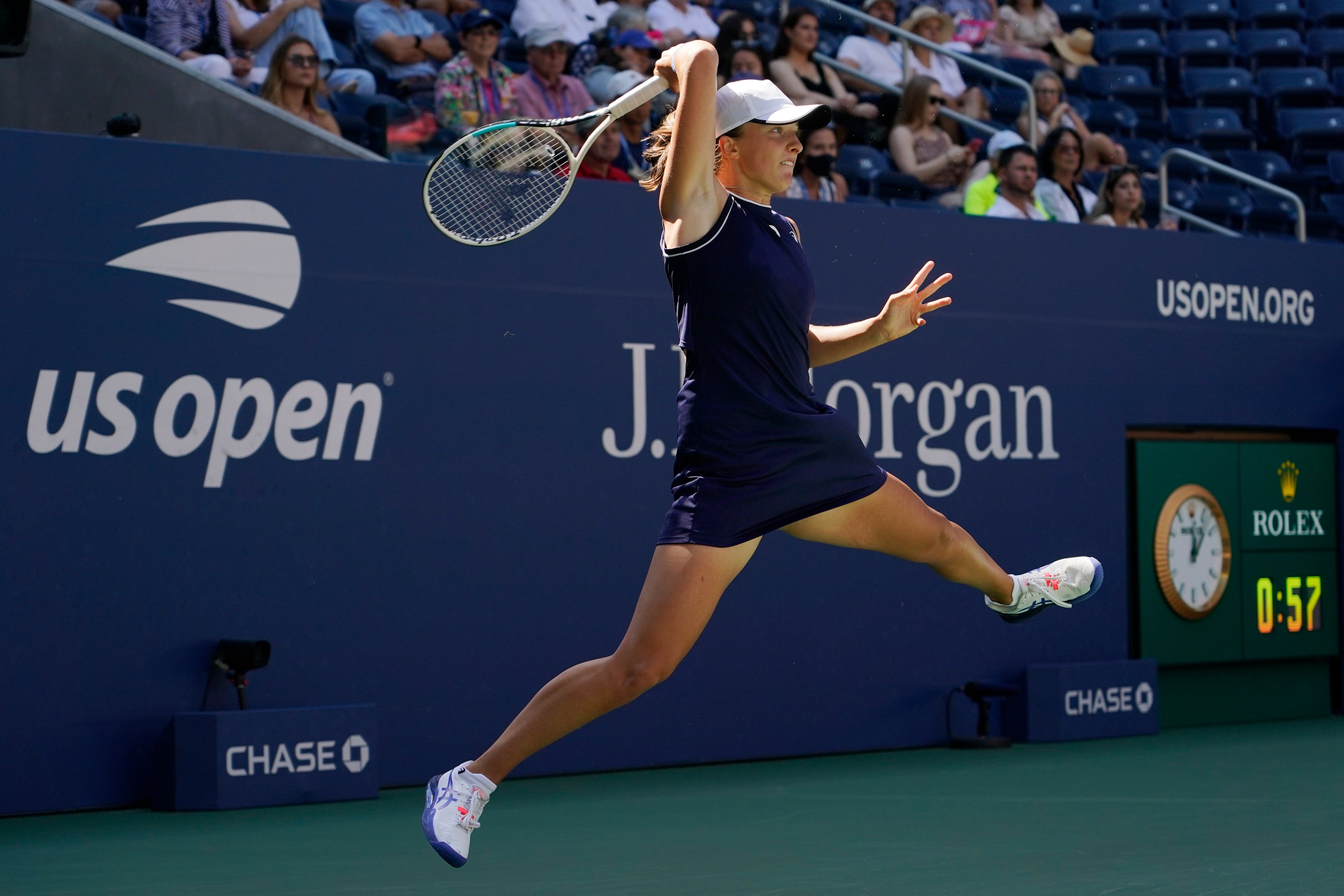 Iga Swiatek hits a forehand during her defeat by Belinda Bencic (Elise Amendola/AP)