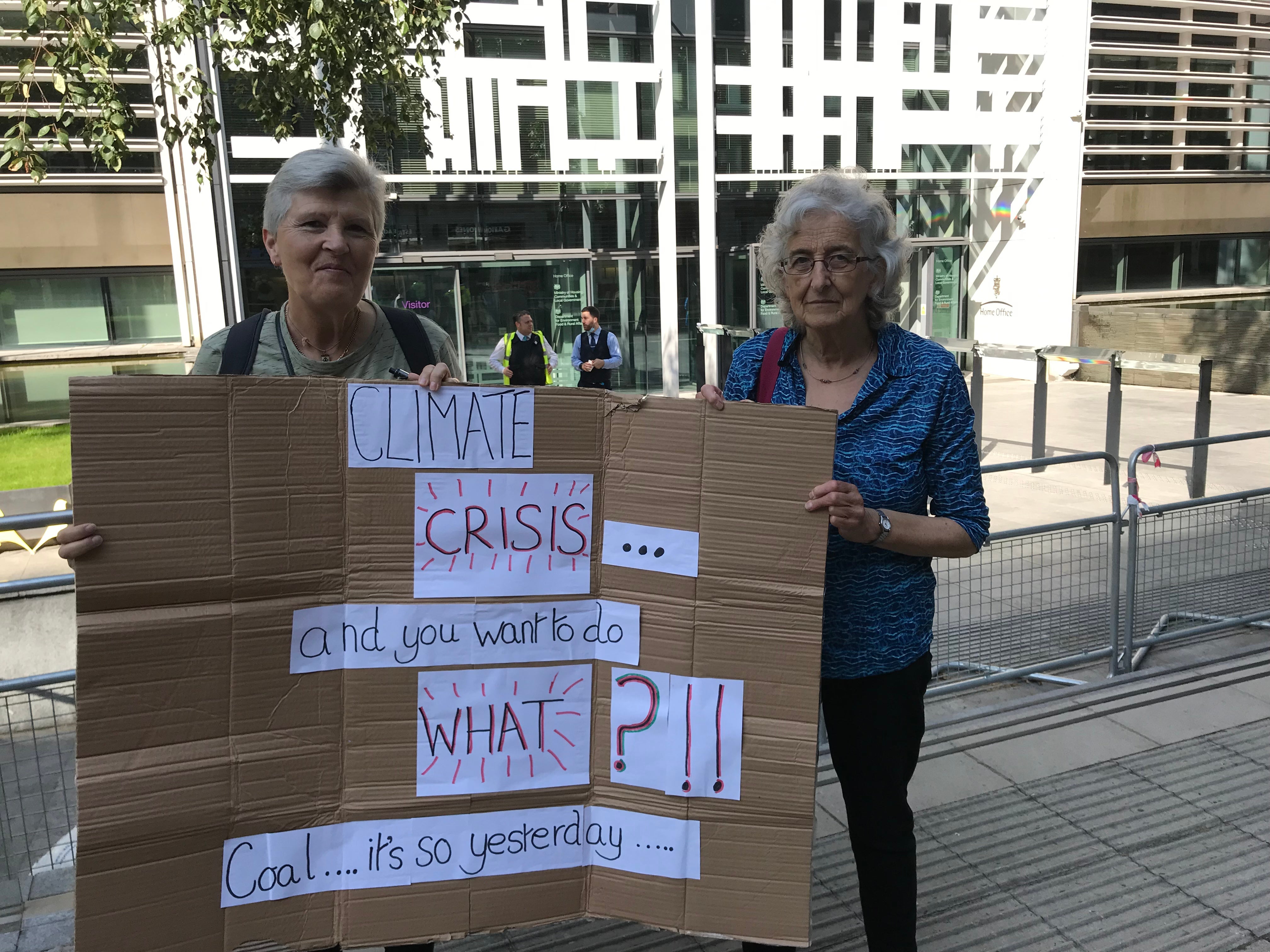 Pamela Laurence (R) and Jill Cass (L) protest in London.