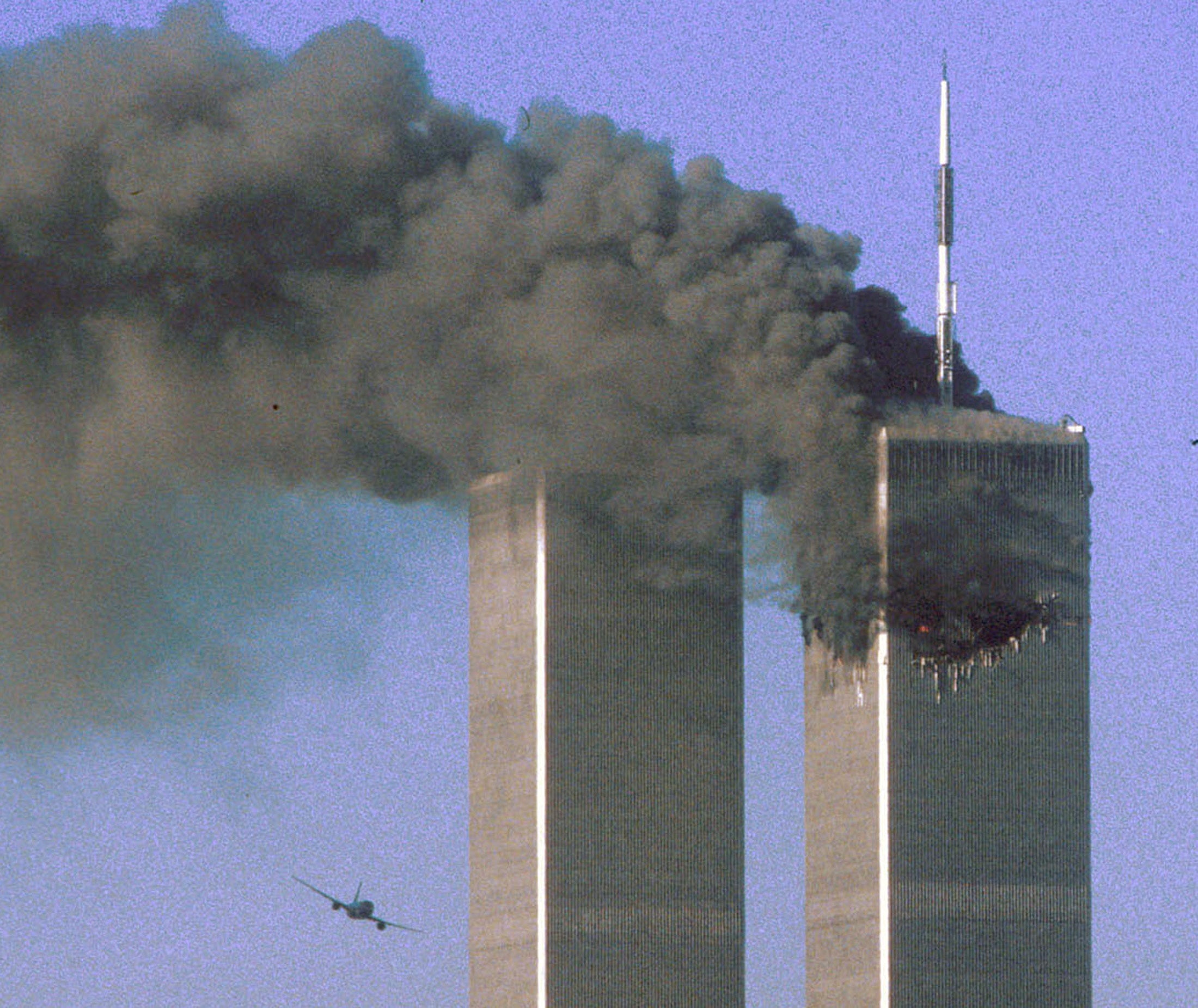 Hijacked United Airlines Flight 175 flies towards the South Tower