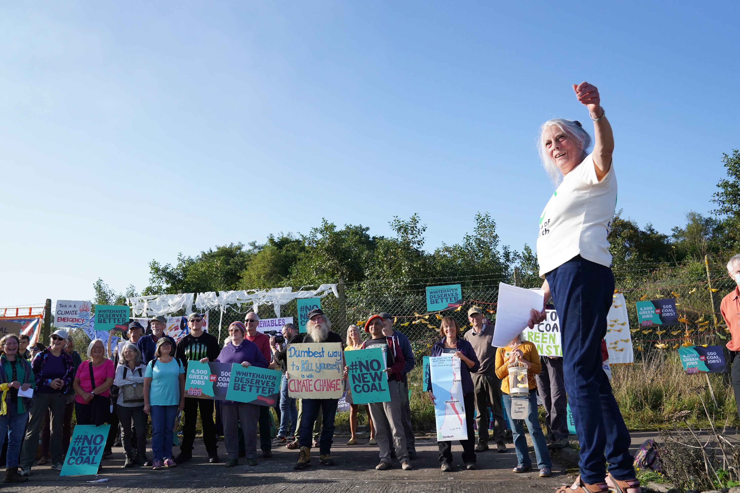 Protesters gather outside the site of the proposed Cumbria coal mine on 7 September, 2021.