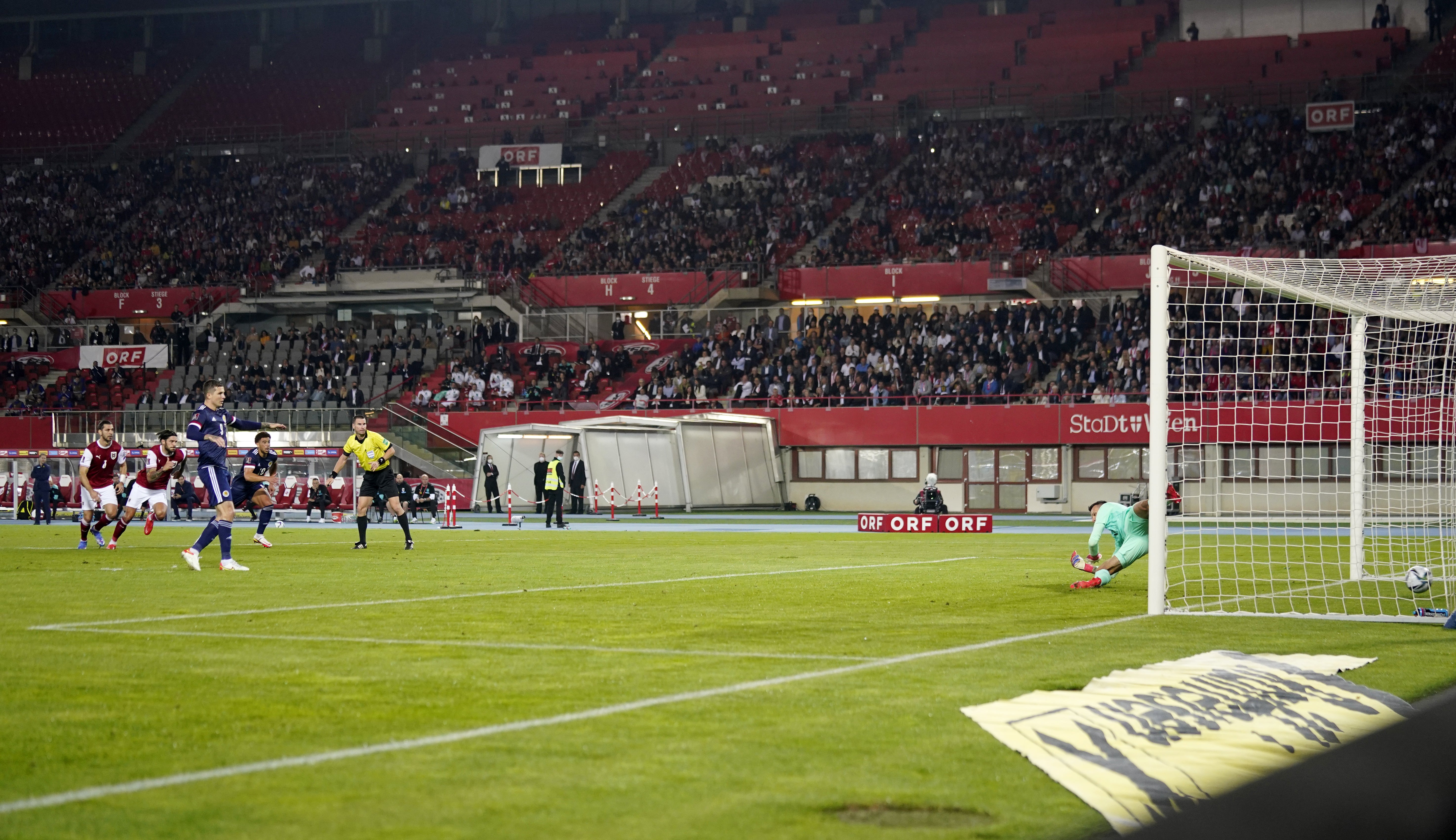 Lyndon Dykes scores from the spot (Florian Schrotter/PA)