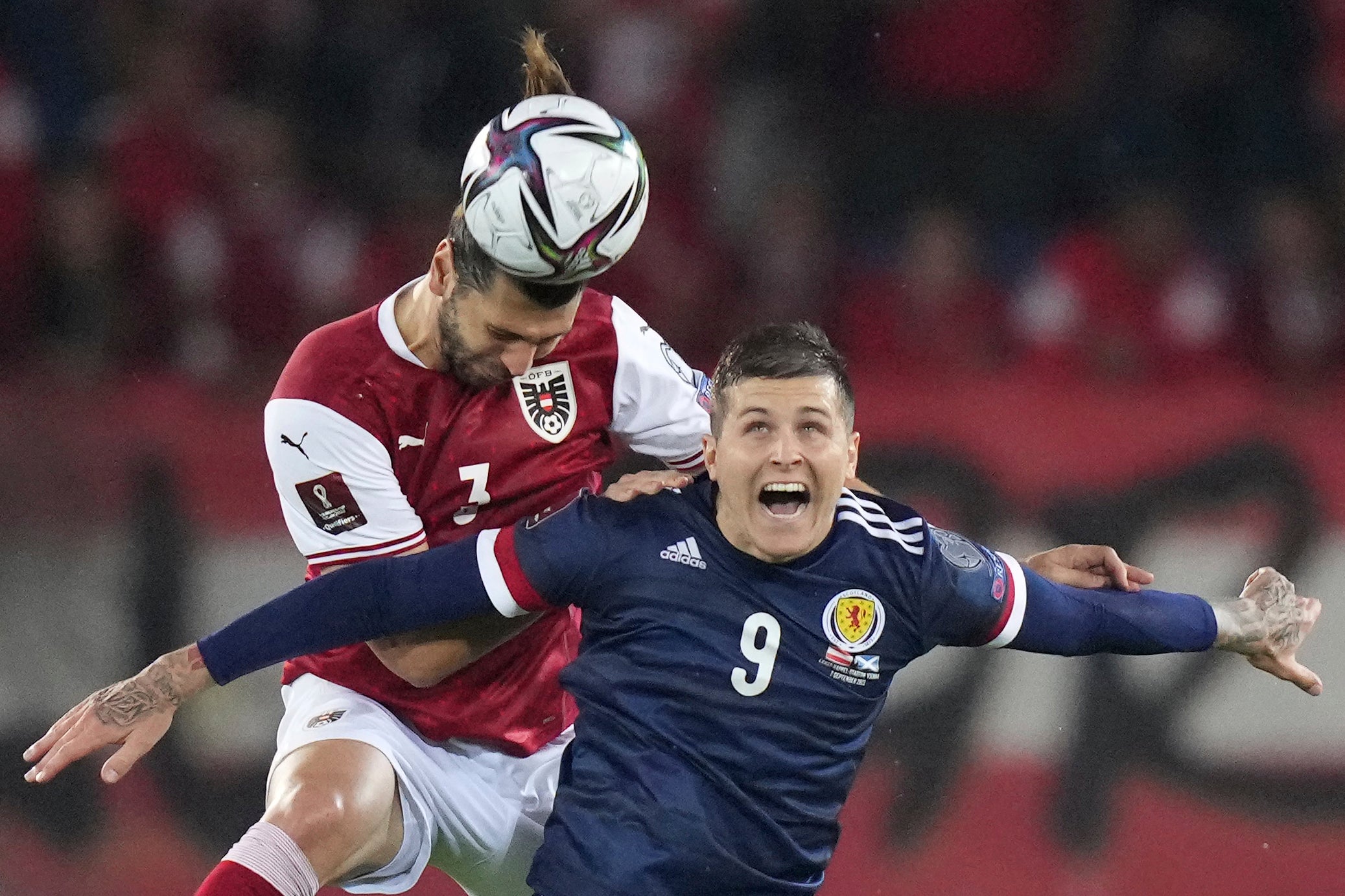 Scotland’s Lyndon Dykes, right, in action against Austria (Matthias Schrader/AP).