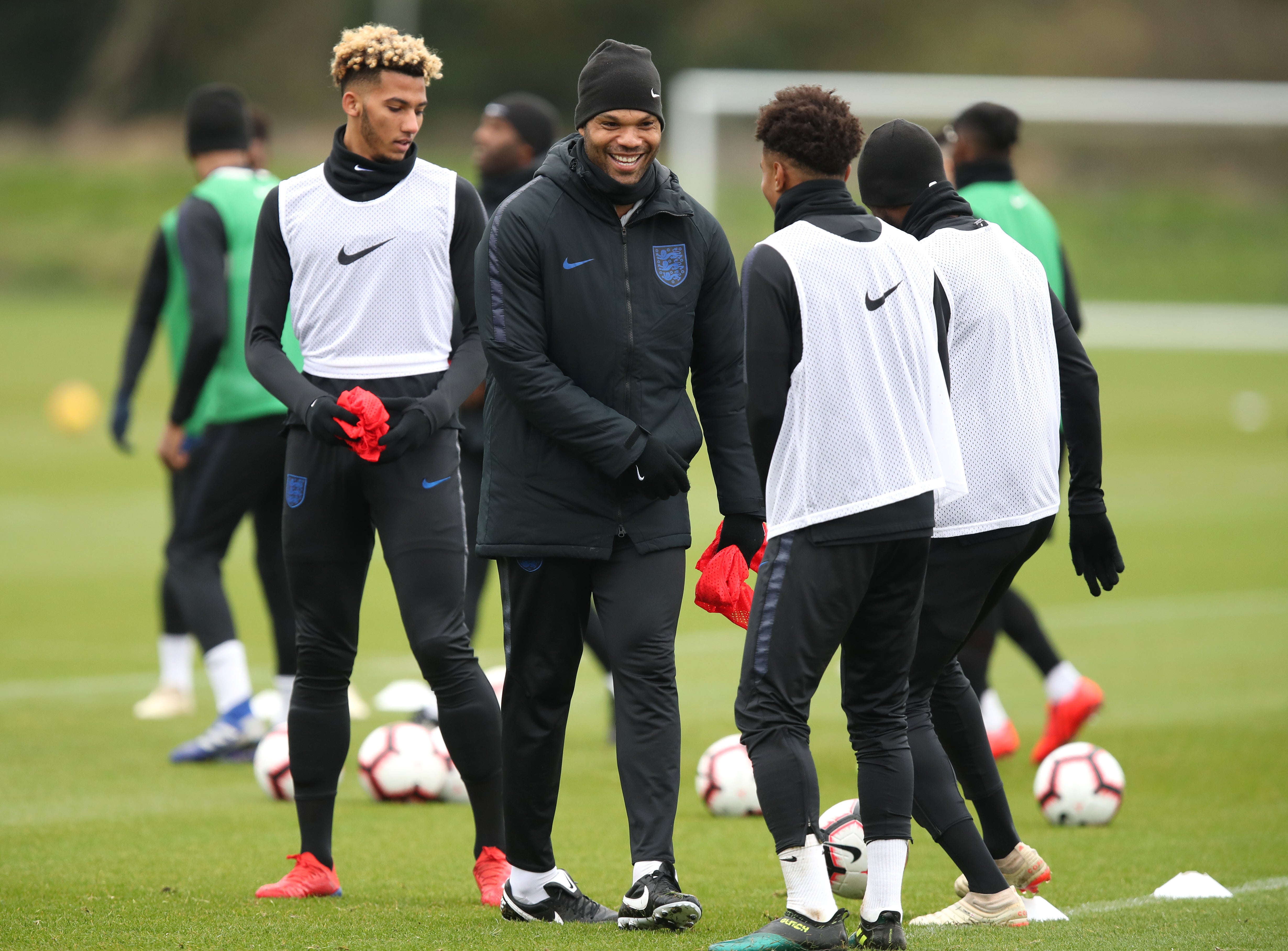 Joleon Lescott, centre, is part of England’s Under-21 coaching set-up (Andrew Matthews/PA)