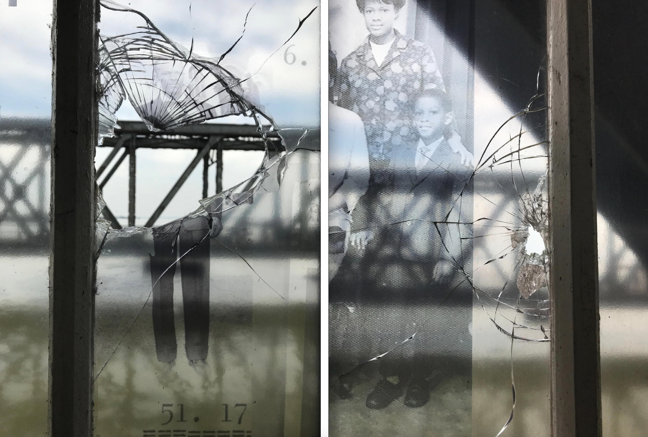 Windows of the walkway exhibition, that display photos of members of the Windrush generation, have been broken