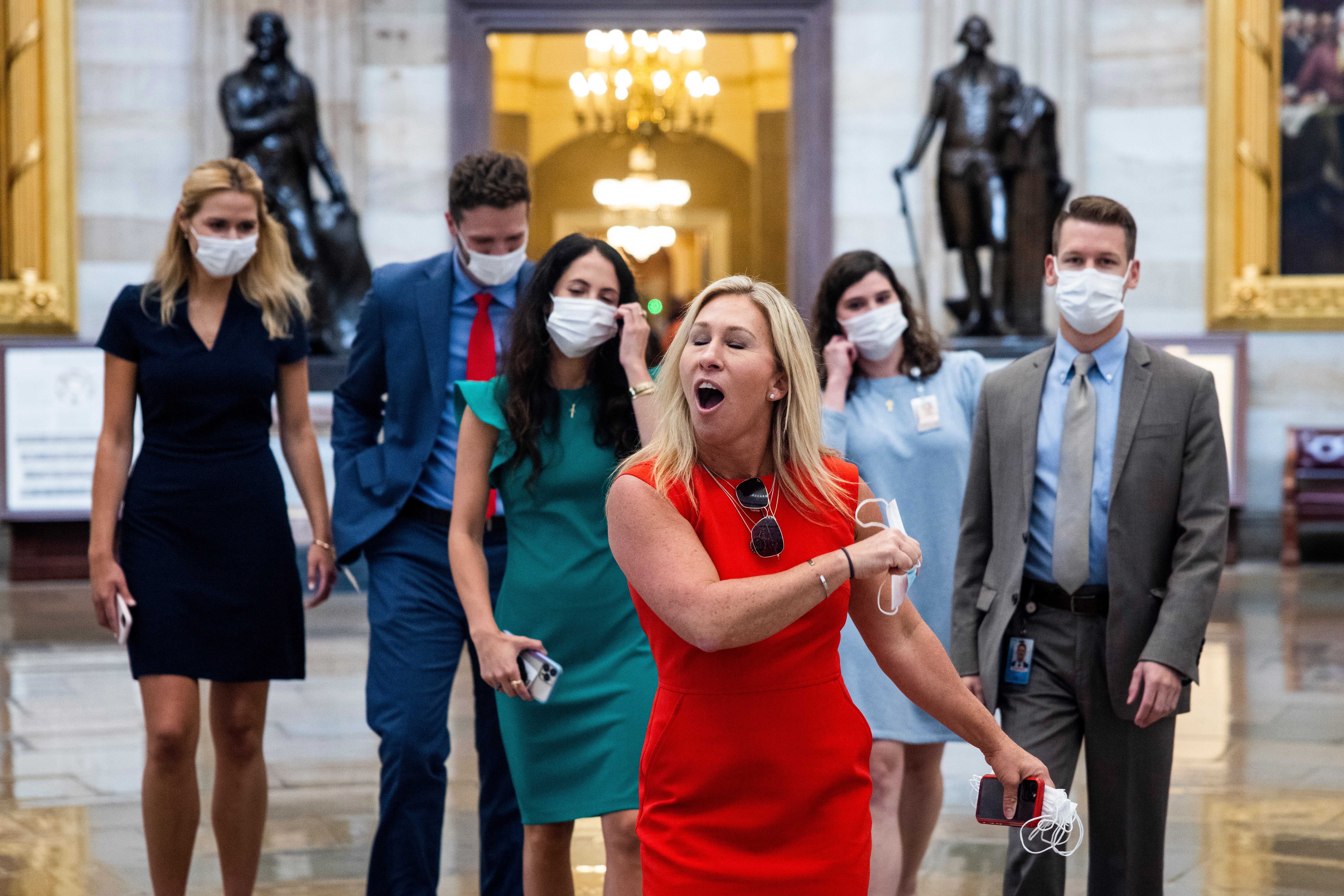 <p>Marjorie Taylor Greene removes rips off mask crossing from House to Senate side of Capitol, where masks were not required</p>