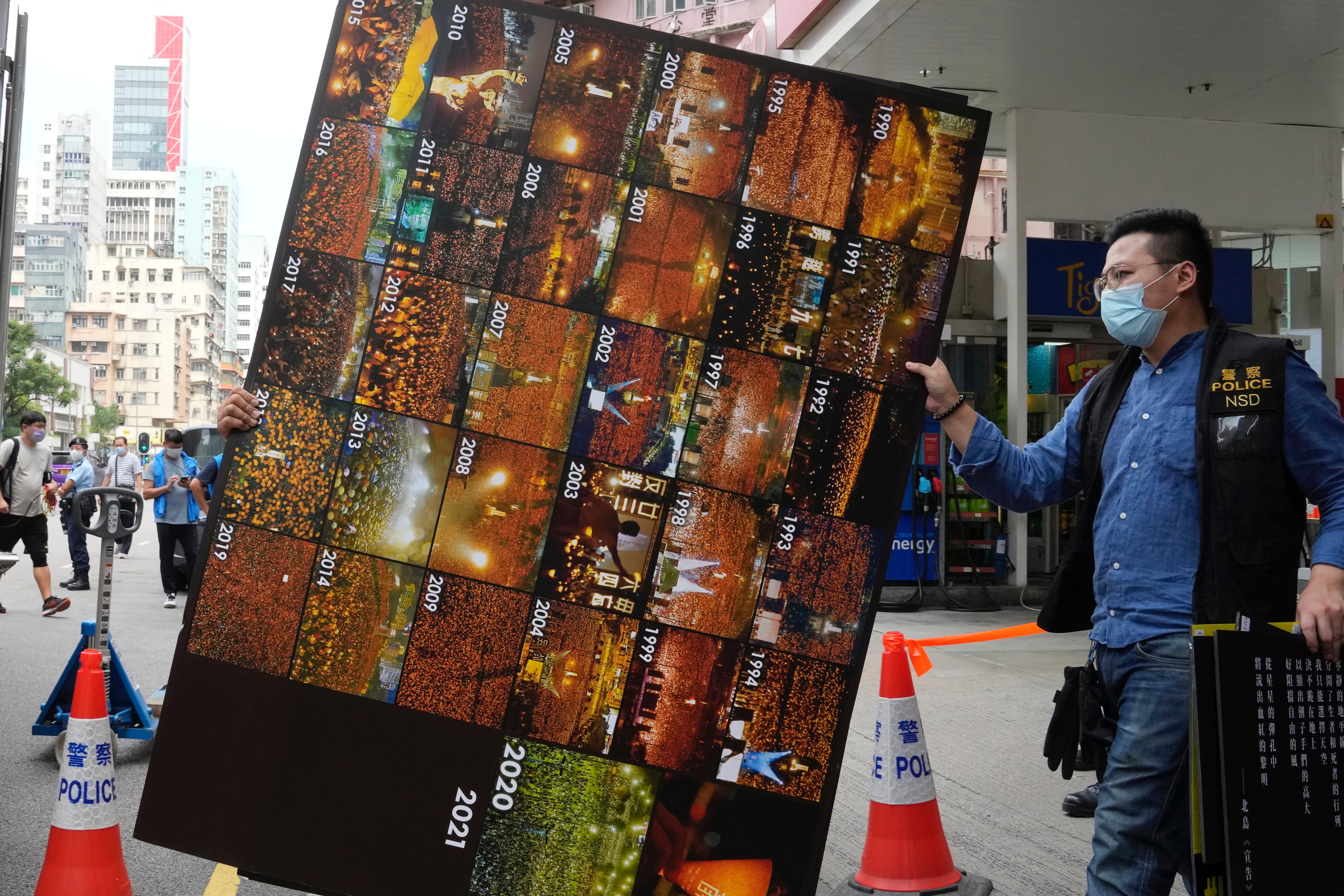 Police remove as evidence pictures of the annual candlelight vigil for Tiananmen Square victims from the June 4th Museum last week