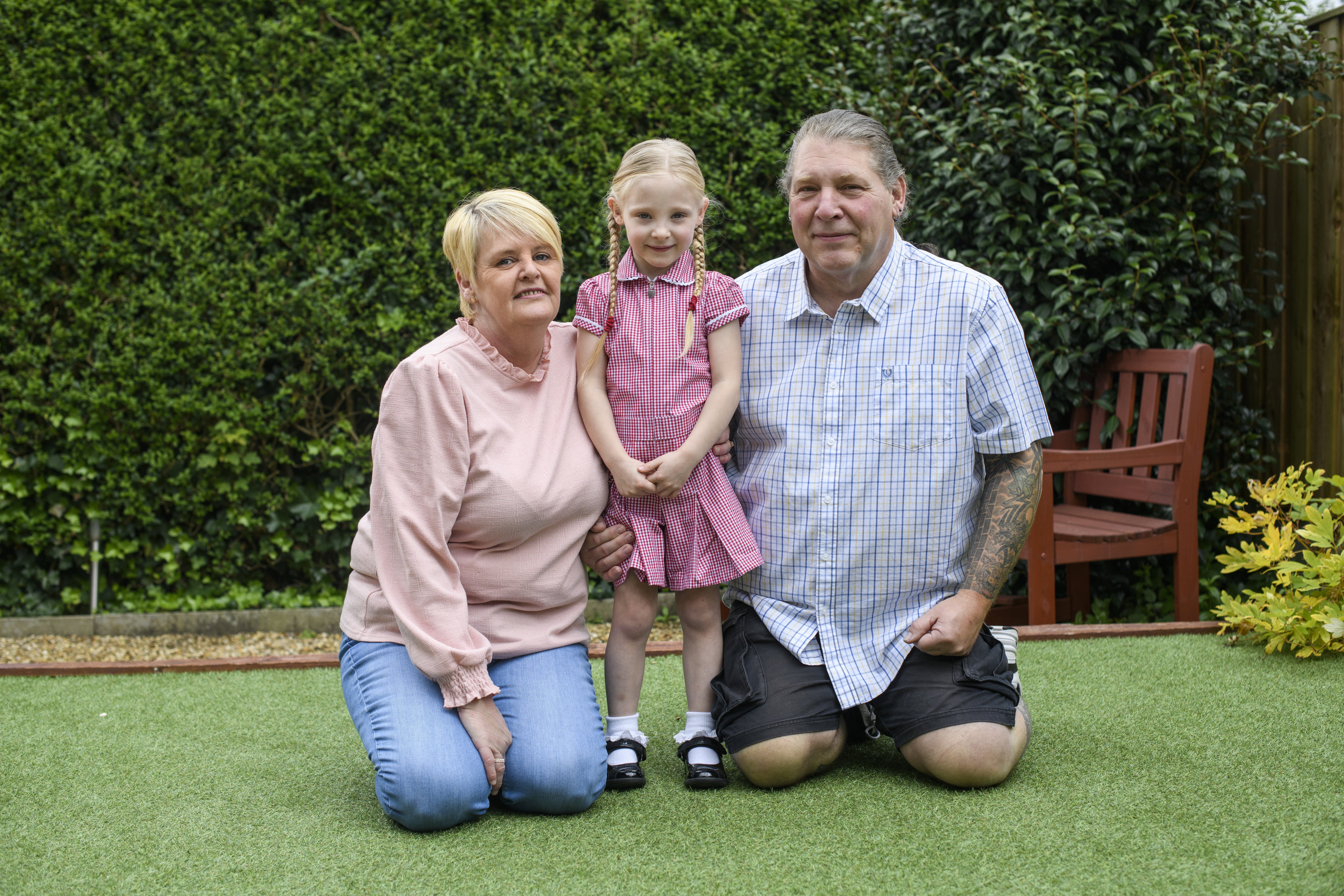 Darcey Clegg, 4, was born so small she was put in a plastic sandwich bag. Pictured here with mum Gill, 50, and dad Mark Moscrop, 58, at home near Oldham