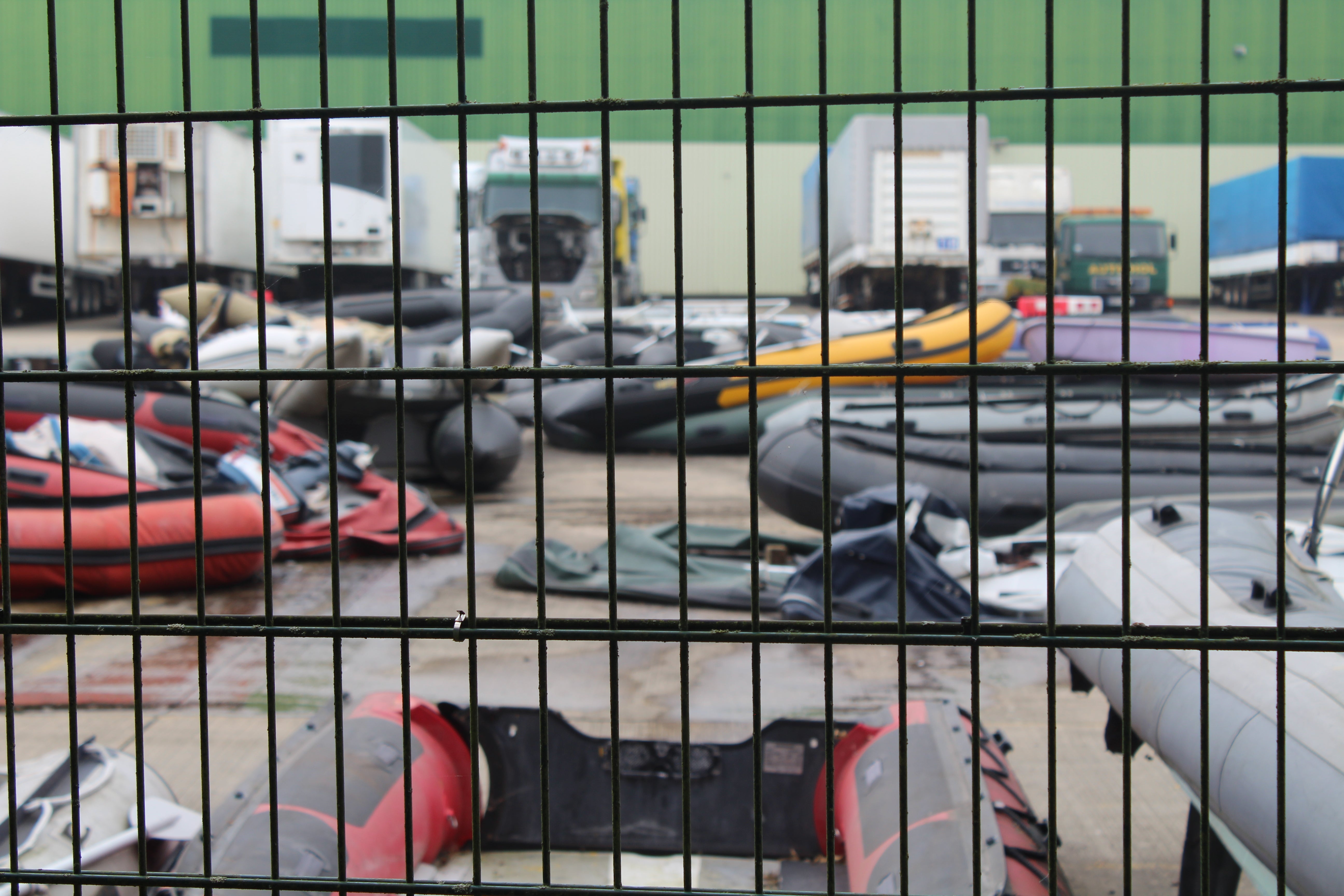 Dinghies used to cross the Channel are stored at a compound in Dover.