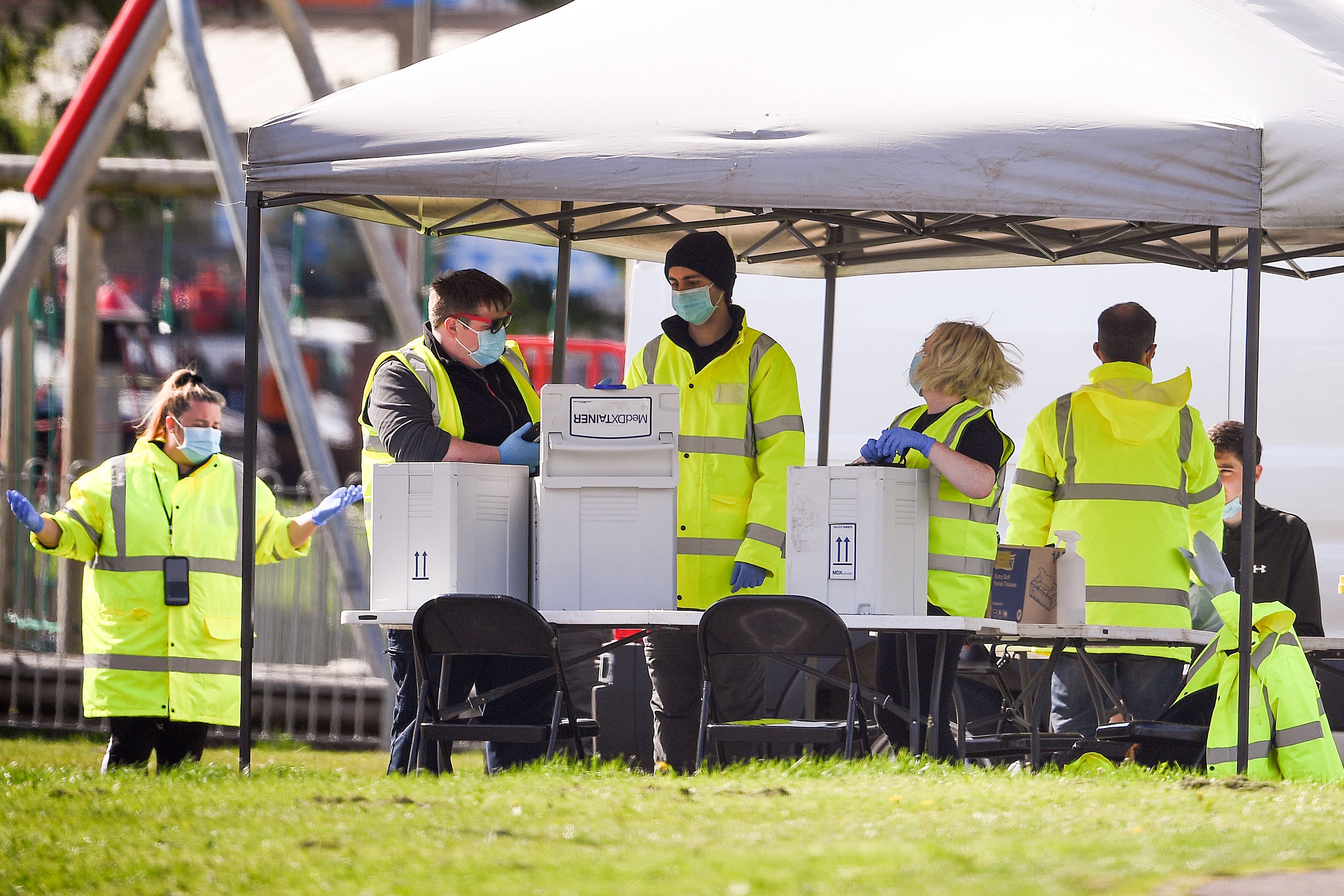 Members of the public get tested at a mobile testing centre in West Dunbartonshire, which has the highest Covid rate in the UK