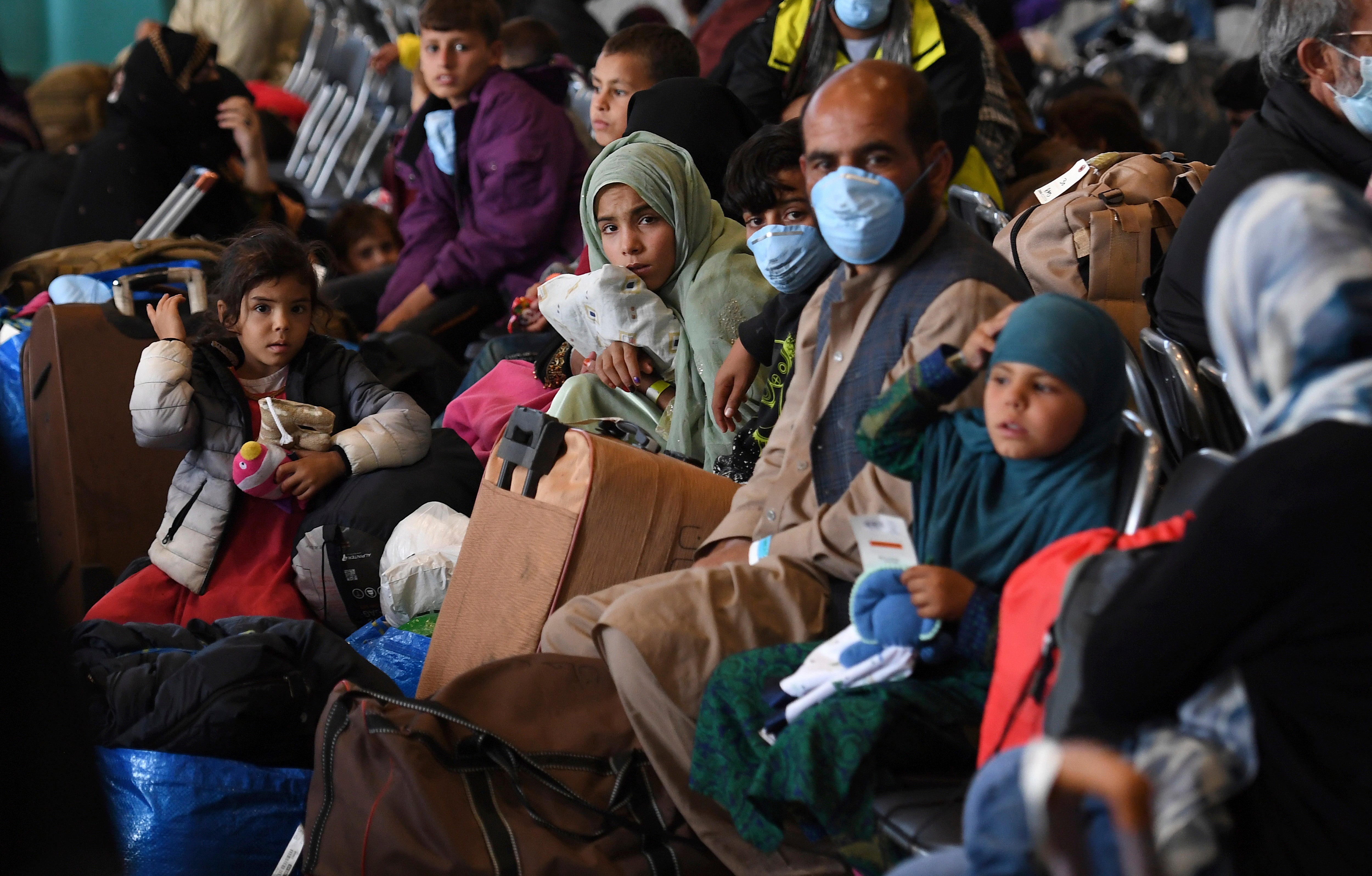 Afghan refugees are processed inside Hangar 5 at the Ramstein U.S. Air Base in Germany in 2021