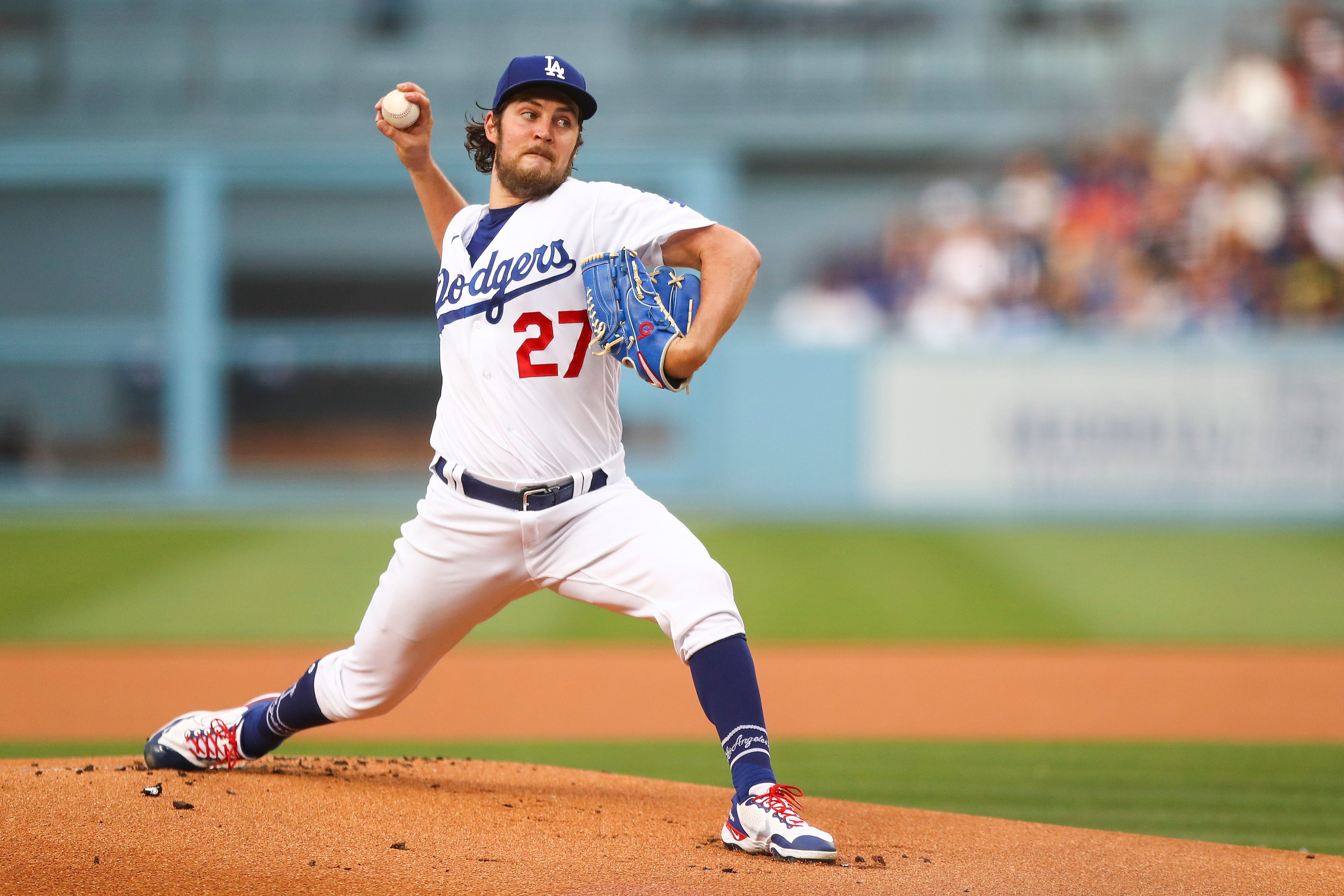 Trevor Bauer #27 of the Los Angeles Dodgers throws the first pitch in the first inning against the San Francisco Giants at Dodger Stadium on June 28, 2021 in Los Angeles, California.