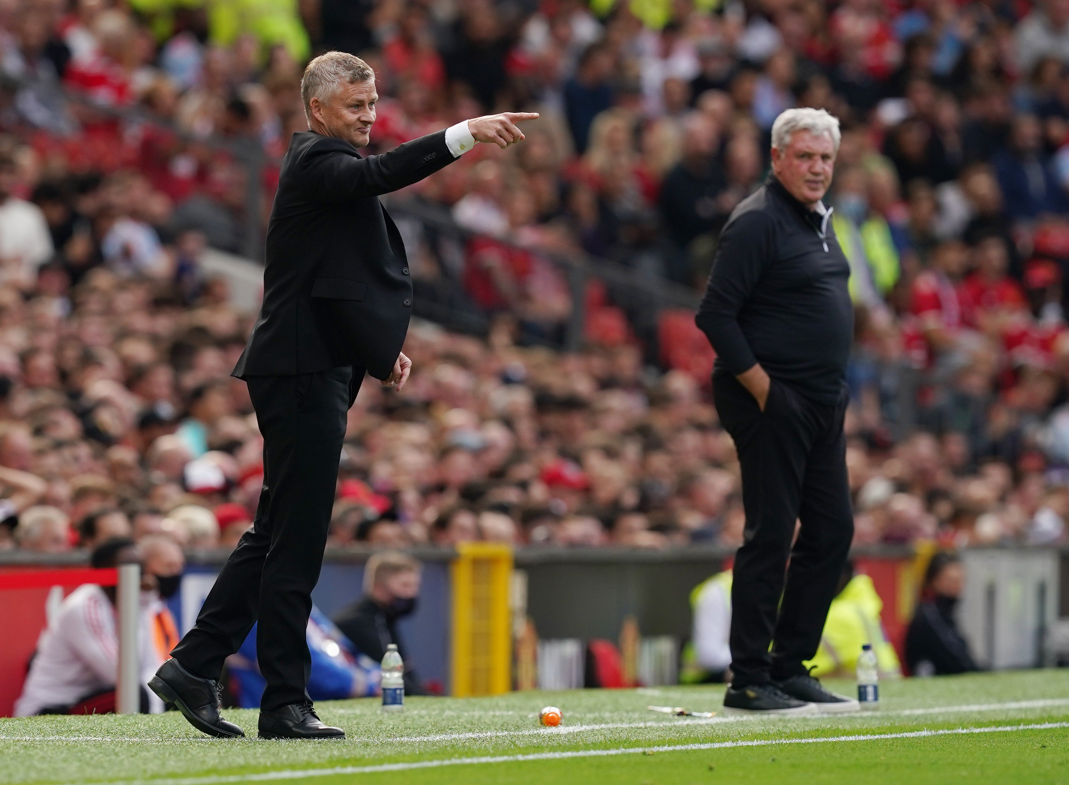 Ole Gunnar Solskjaer enjoyed his day but there was frustration for Steve Bruce, background (Martin Rickett/PA)