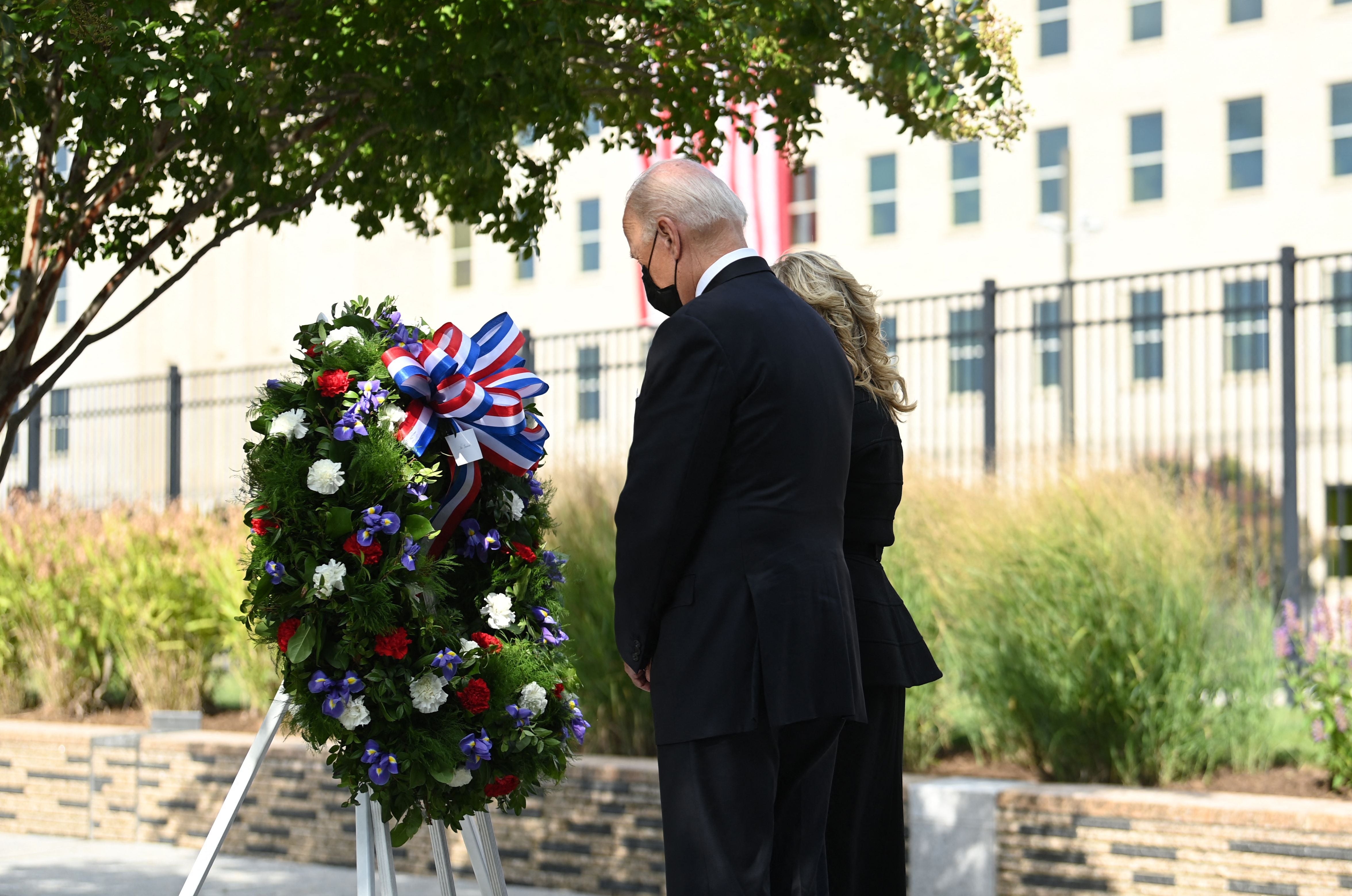 US President Joe Biden and First Lady Jill Biden attend a wreath laying ceremony as they pay their respects to 9/11 victims at the Pentagon, Virginia, September 11, 2021. (Photo by Brendan SMIALOWSKI / AFP) (Photo by BRENDAN SMIALOWSKI/AFP via Getty Images)