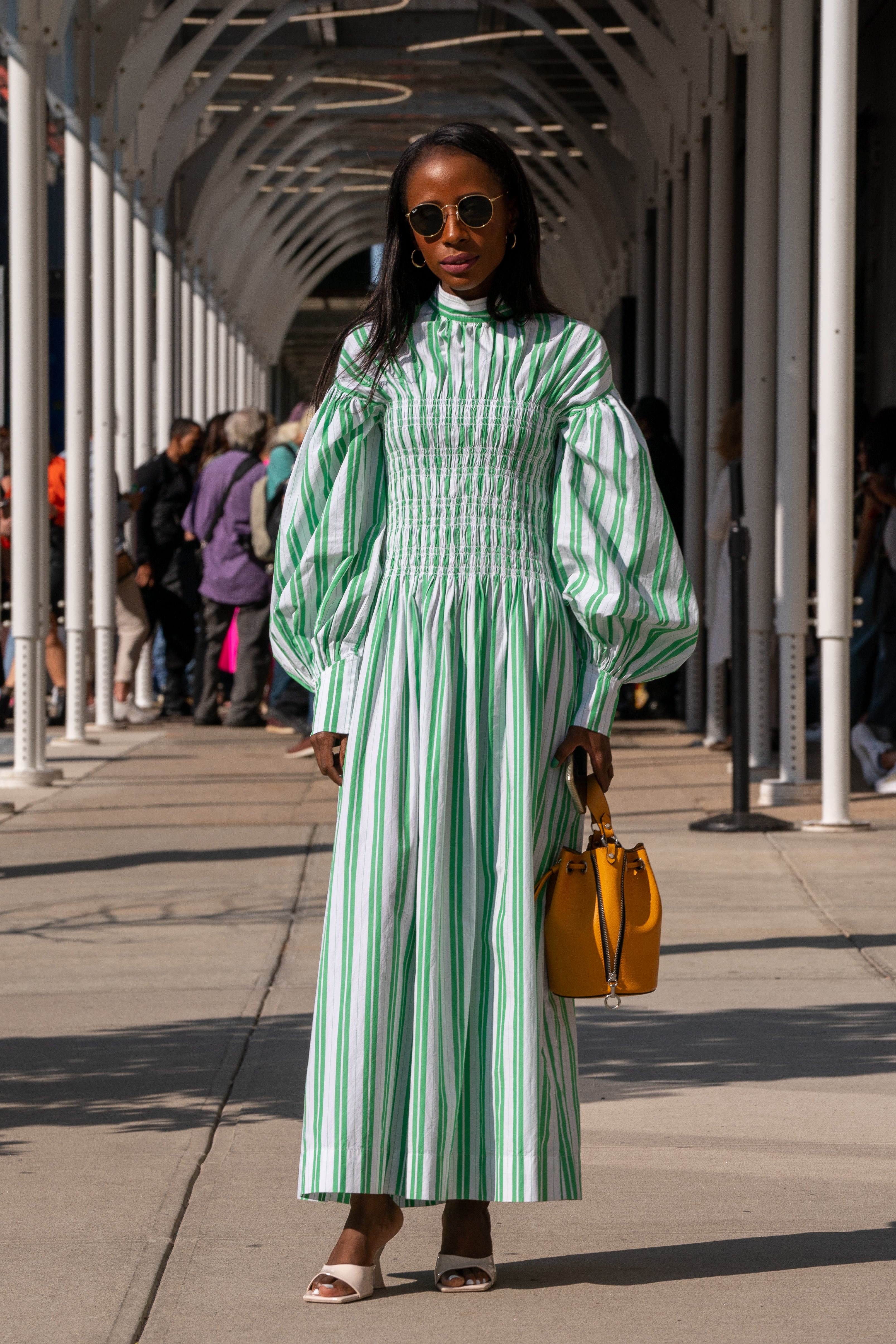 She wore a green and white dress by Ganni paired with a hand bag and shoes by Zara.