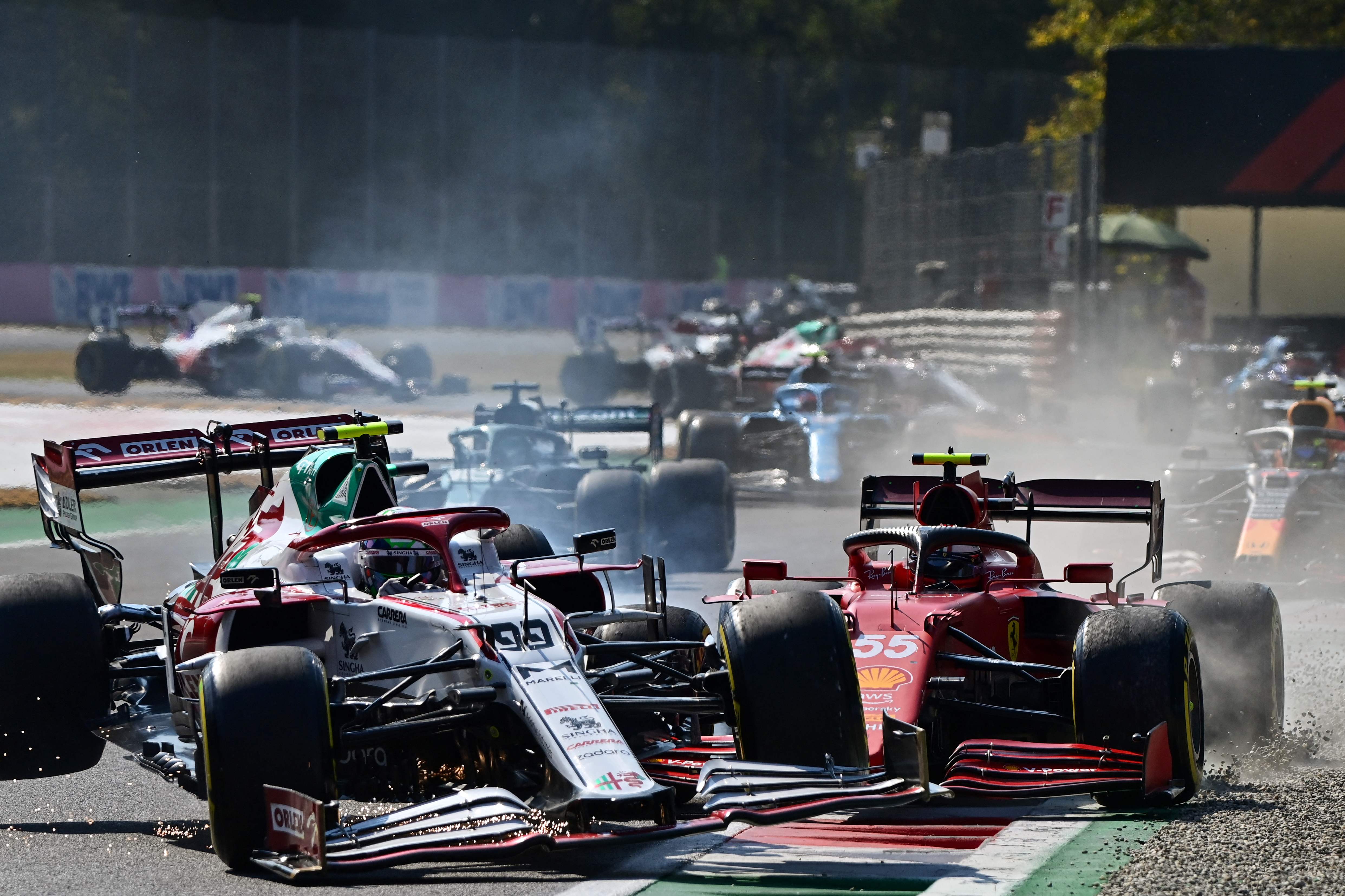 Antonio Giovinazzi (left) collides with Ferrari’s Carlos Sainz