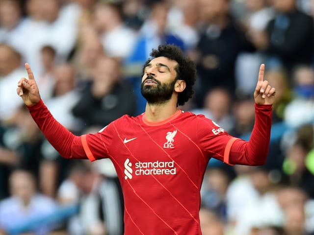 <p>Liverpool’s Harvey Elliott (right) and Leeds’ Junior Firpo</p>