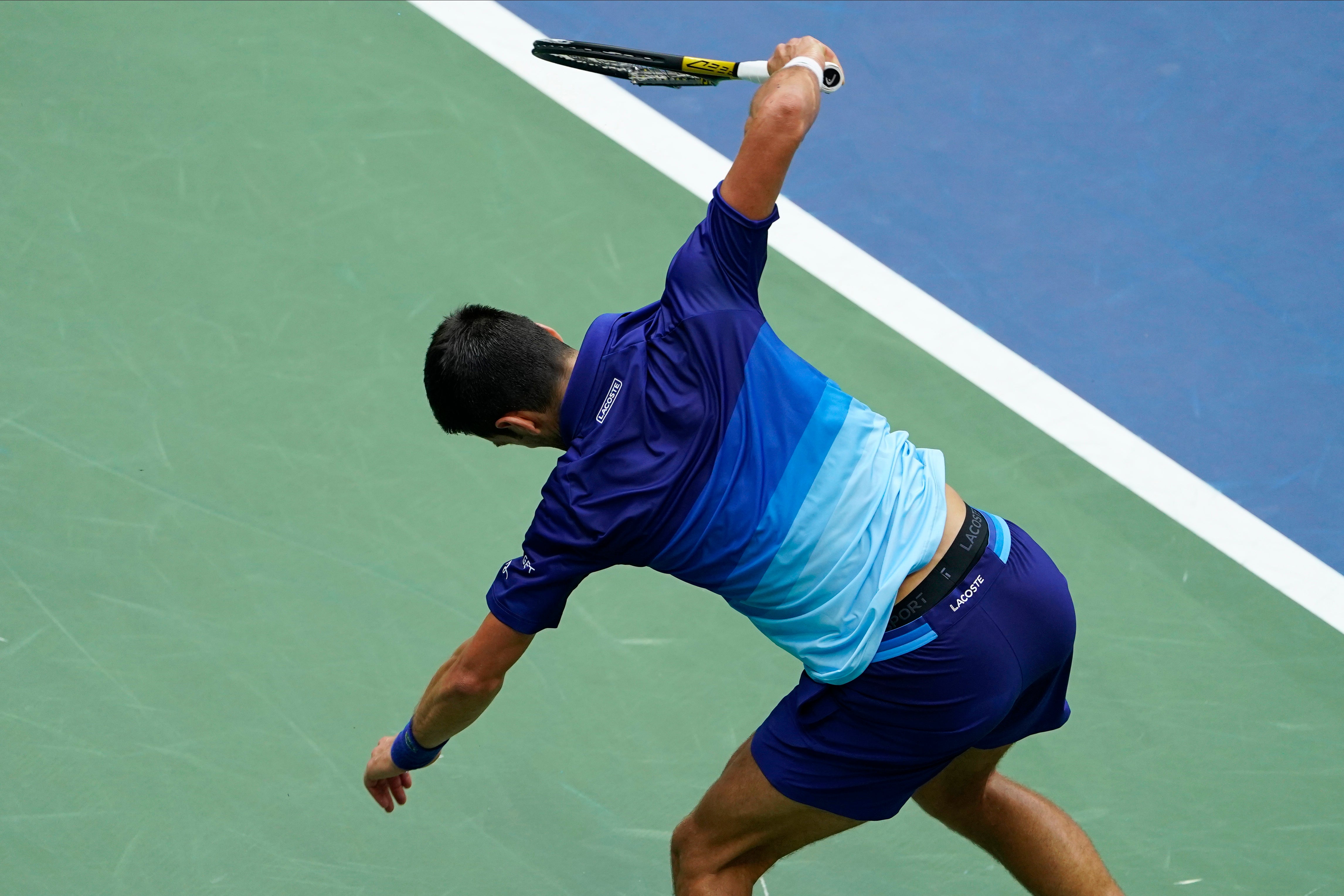 Novak Djokovic smashes his racket early in the second set (Seth Wenig/AP)