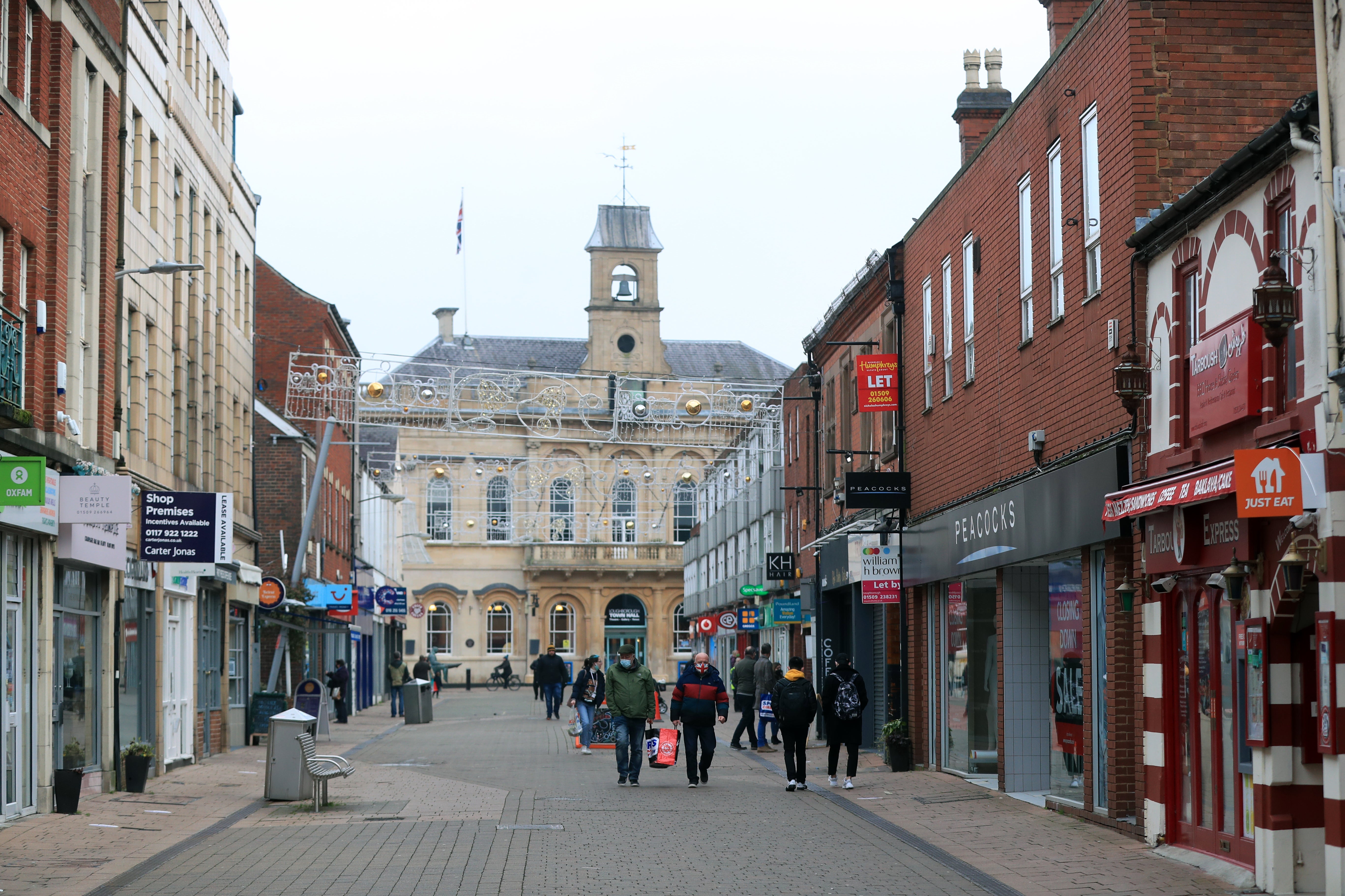 People walk along the high street in Loughborough (Mike Egerton/PA)