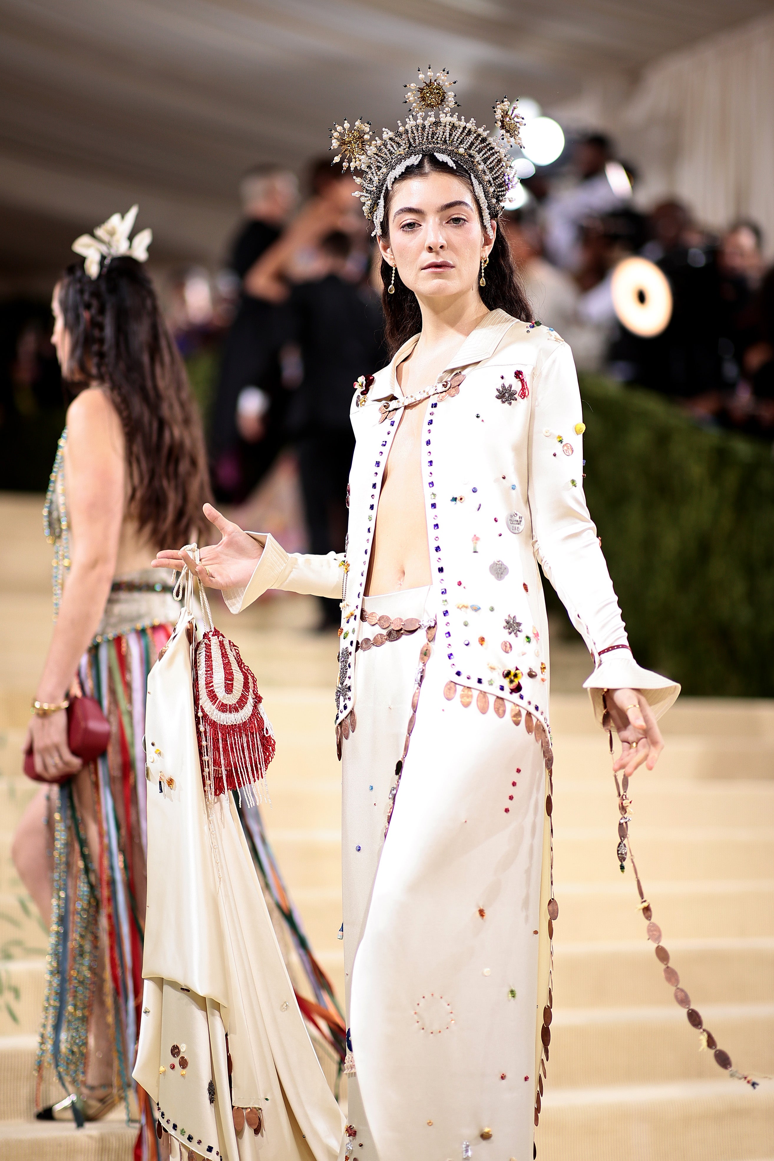 The singer wore a creame two-piece that featured colourful jewels and embellishments by Bode. She also wore a pearl-adorned headpiece.