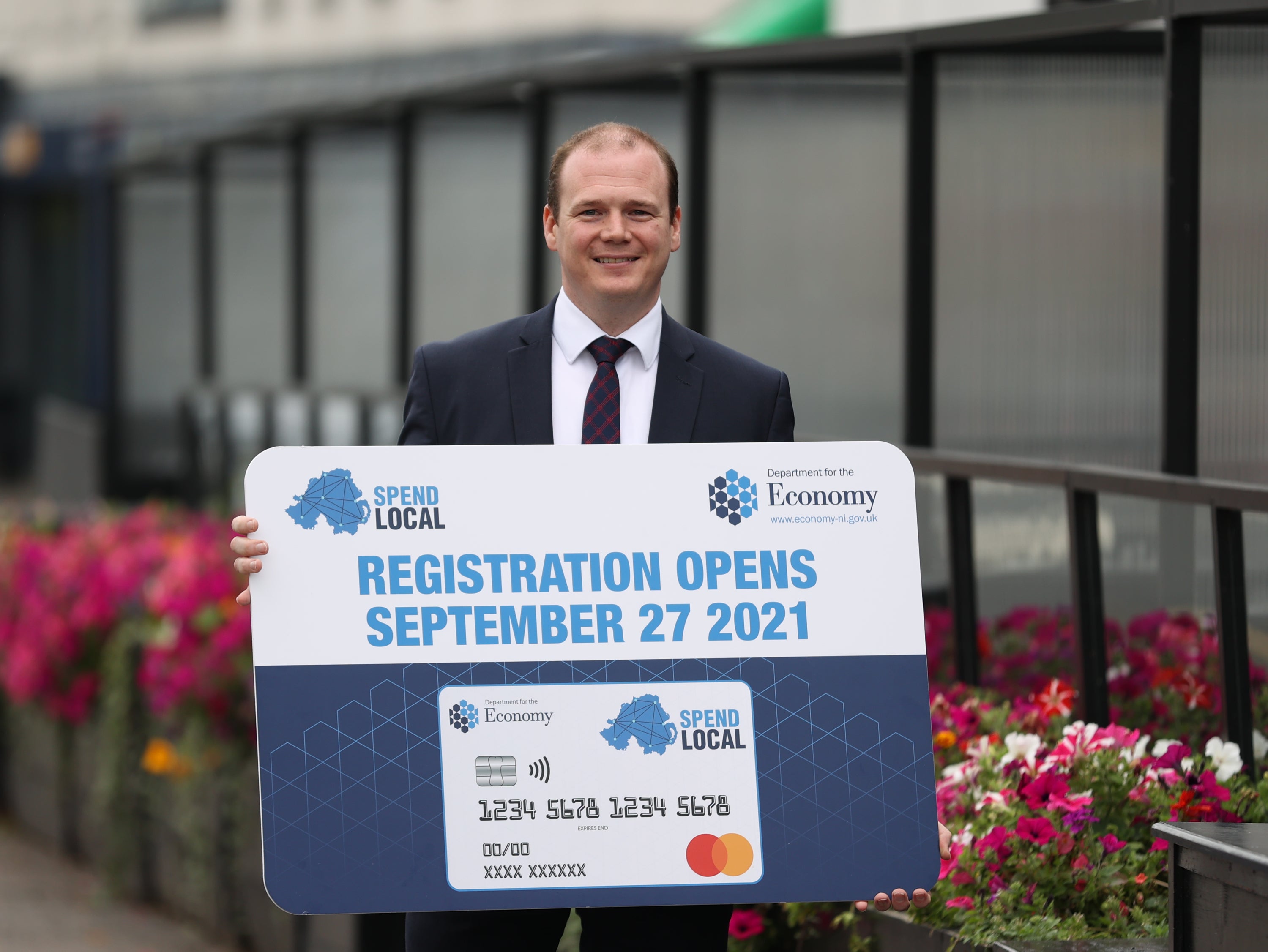 Economy Minister Gordon Lyons said a high street voucher scheme, which will offer pre-paid cards worth £100 to every adult in Northern Ireland, will open for applications on September 27 (Liam McBurney/PA)