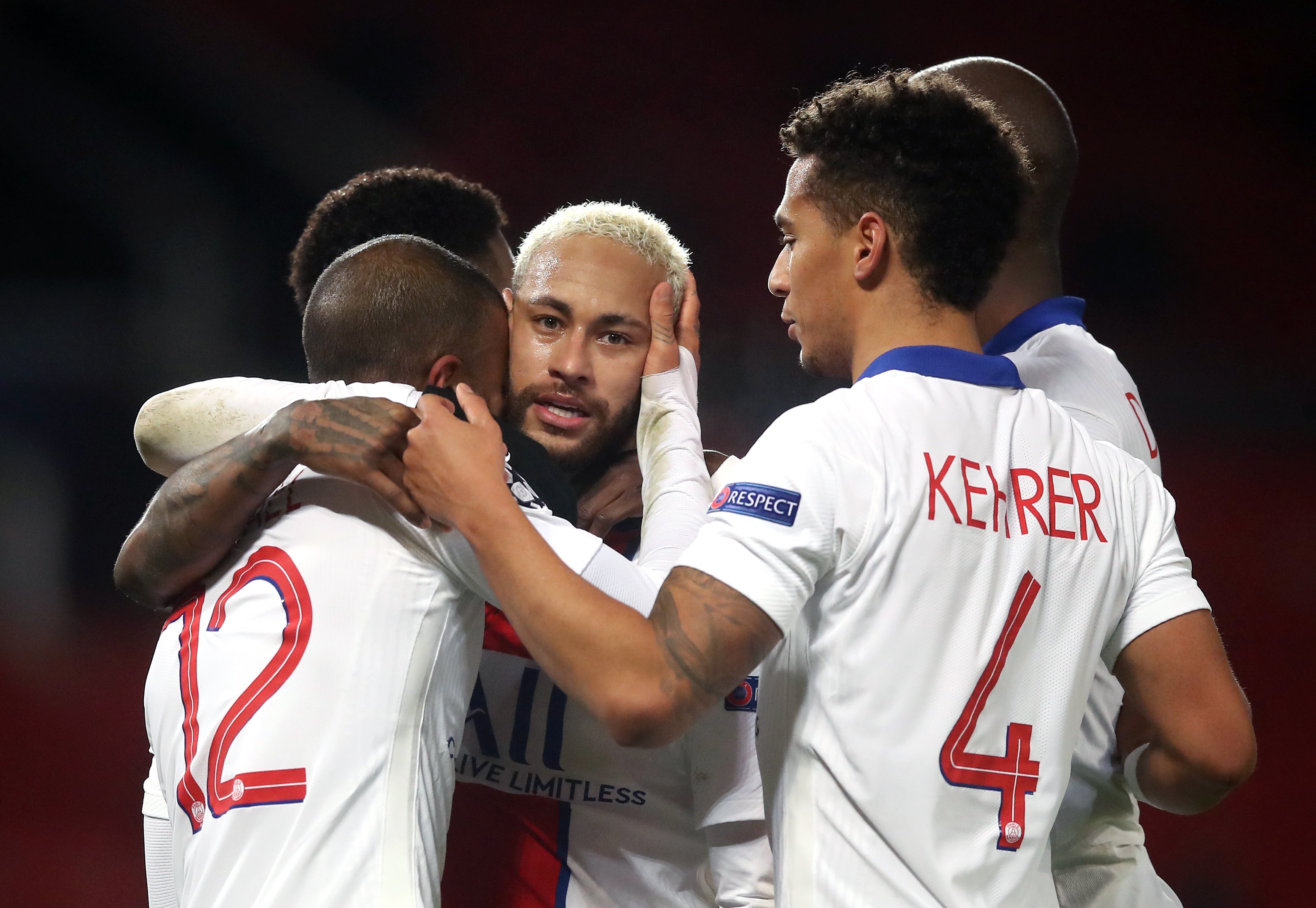 PSG’s Neymar celebrates with his team-mates after scoring the third goal at at Old Trafford (Martin Rickett/PA)