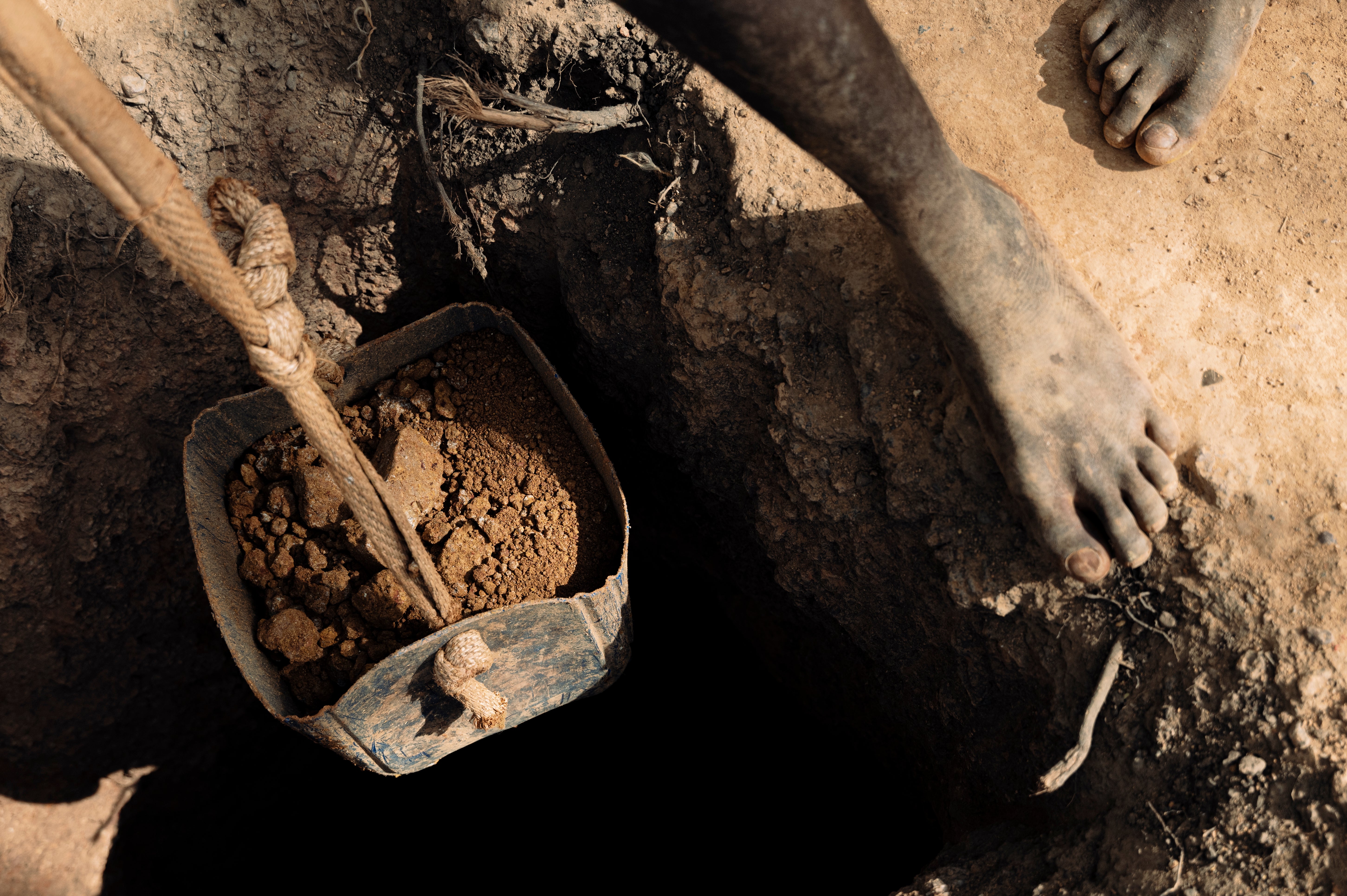 Boys hauling up the loads of excavated gold bearing rock which will be passed into crushers and washed through for gold