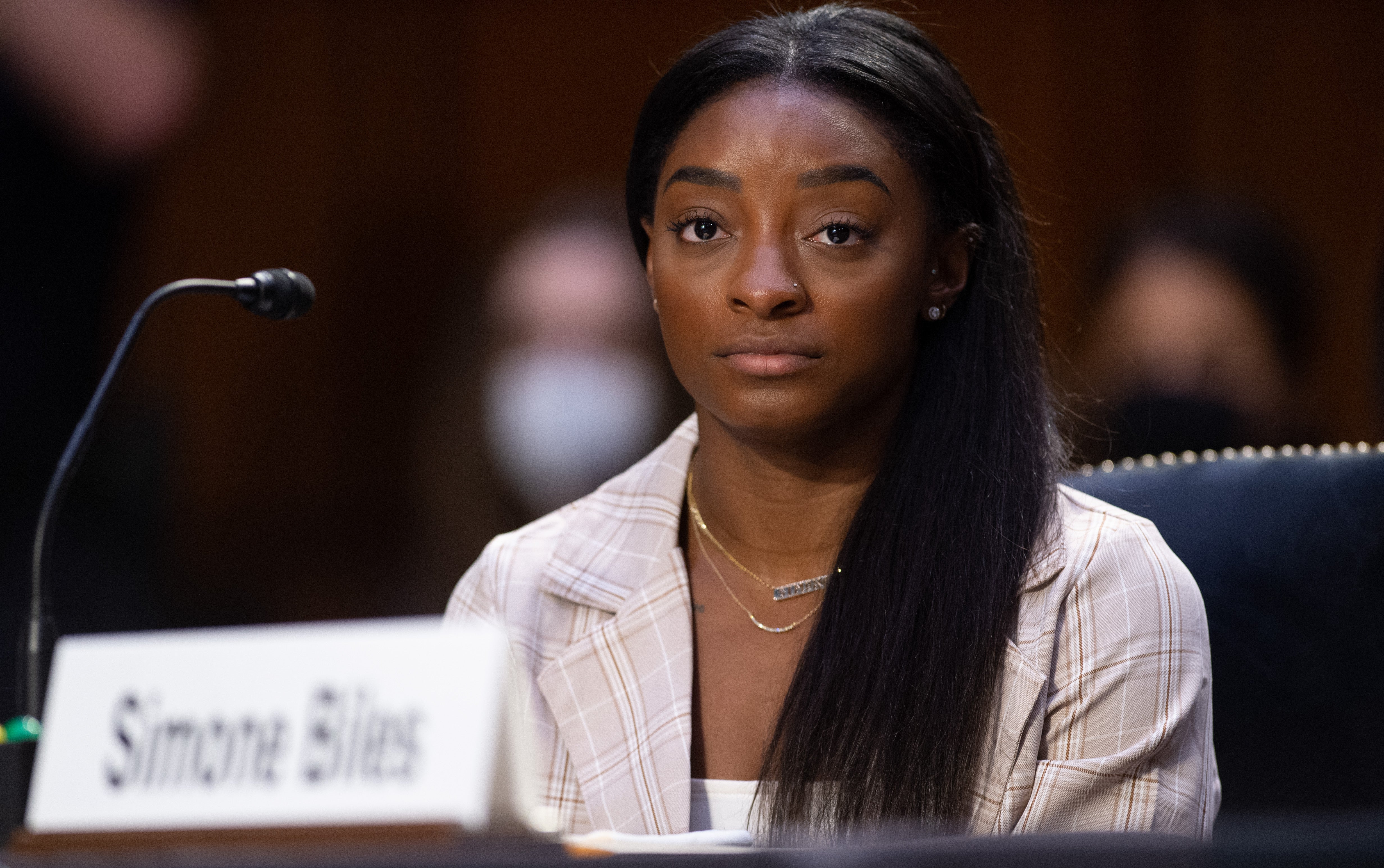 Simone Biles speaks at a hearing at the US Senate