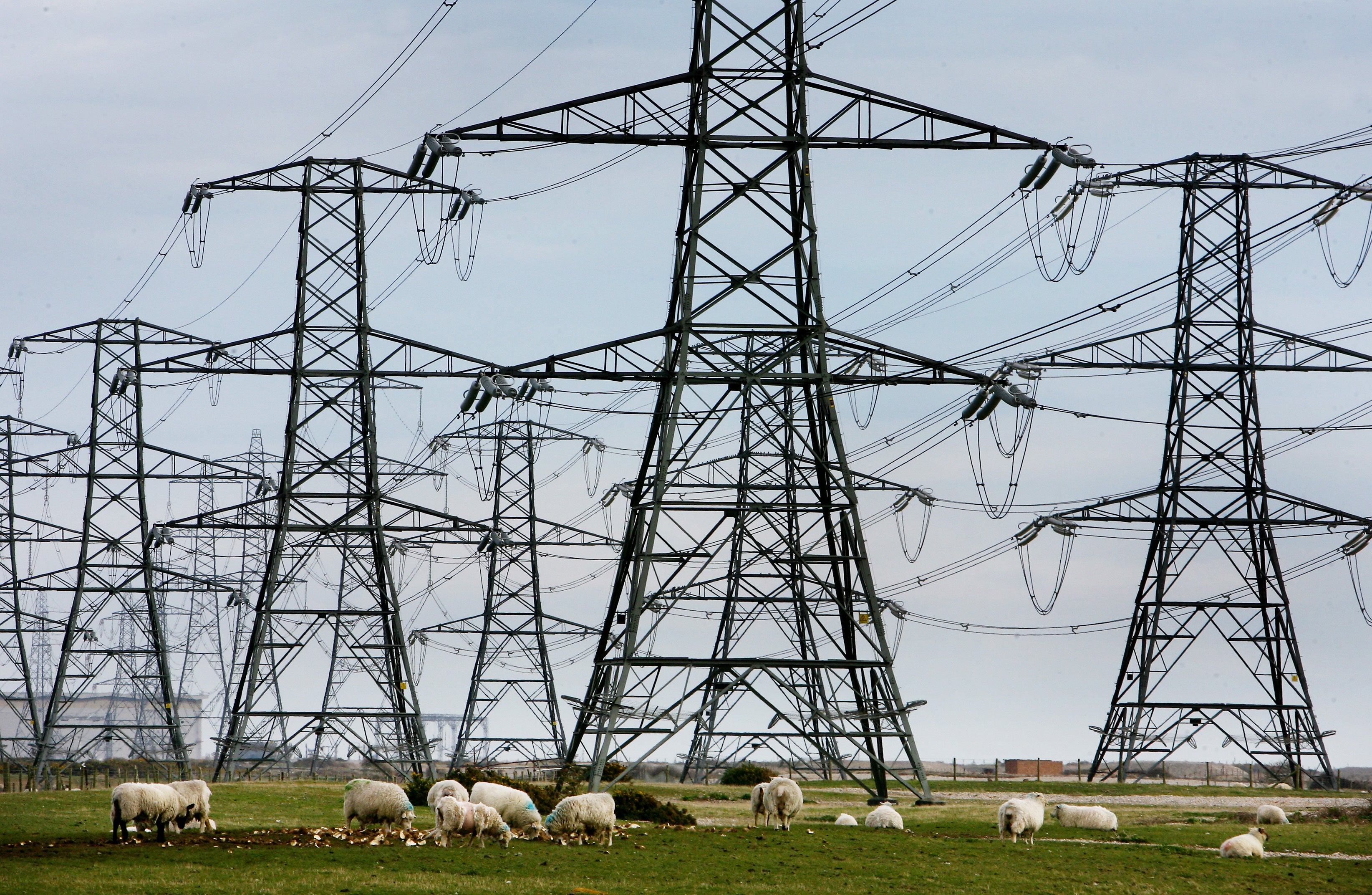 A view of overhead power cables from the Dungeness Nuclear Power Station and stretching across the Kent countryside